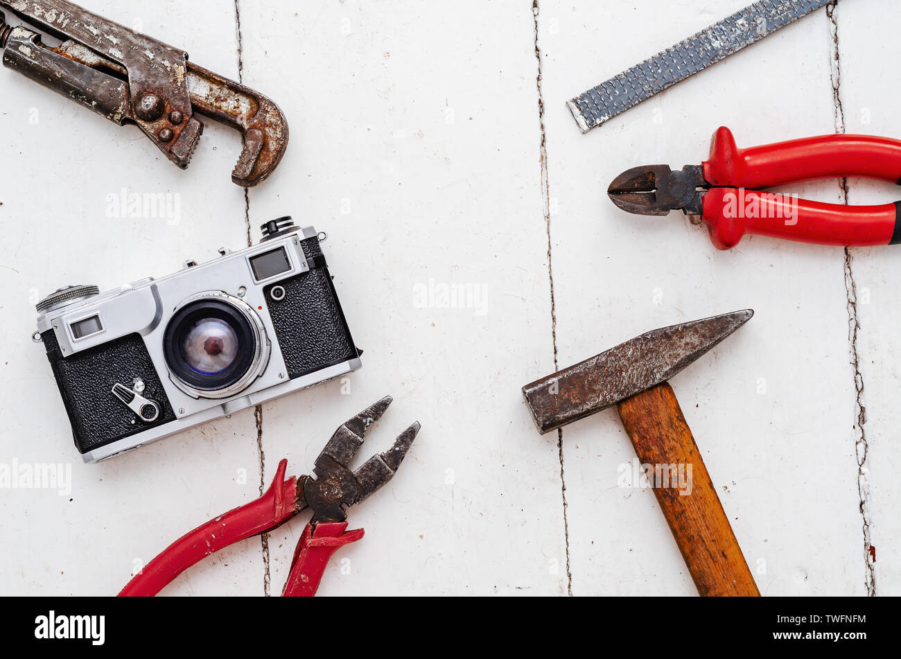 Composition of old tools, pliers, hammer, wrench, nippers and a vintage ...