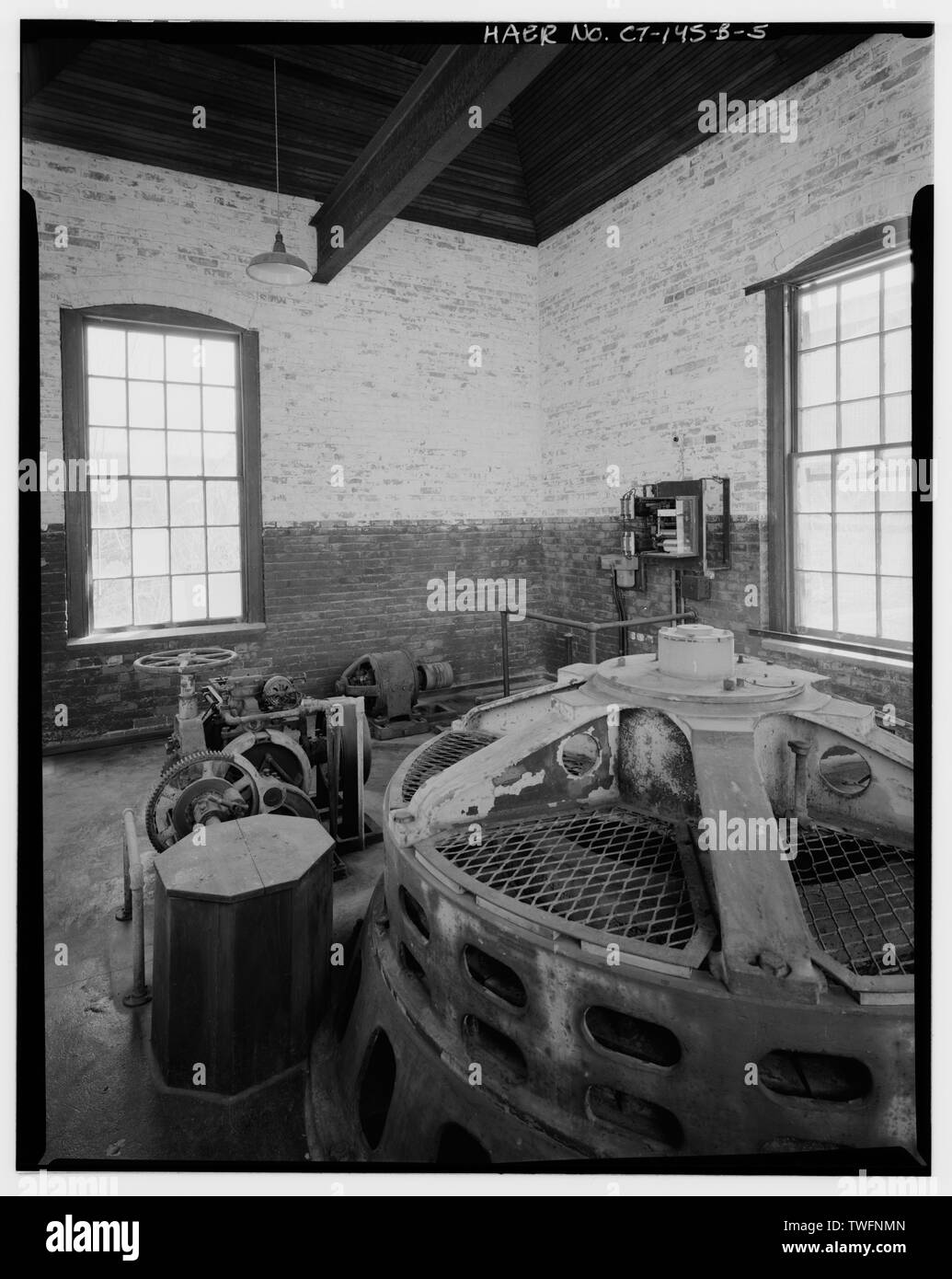 POWERHOUSE, GROUND LEVEL, LOOKING SOUTHEAST GENERATOR, GOVERNOR, EXCITER AND KILOWATT-HOUR RECORDER LOCATED IN POWERHOUSE AT GROUND LEVEL LOOKING SOUTHEAST - Dayville Mills Hydroelectric Facility, Powerhouse, North side of Route 101, .5 mile west of Route 395, Killingly Center, Windham County, CT Stock Photo