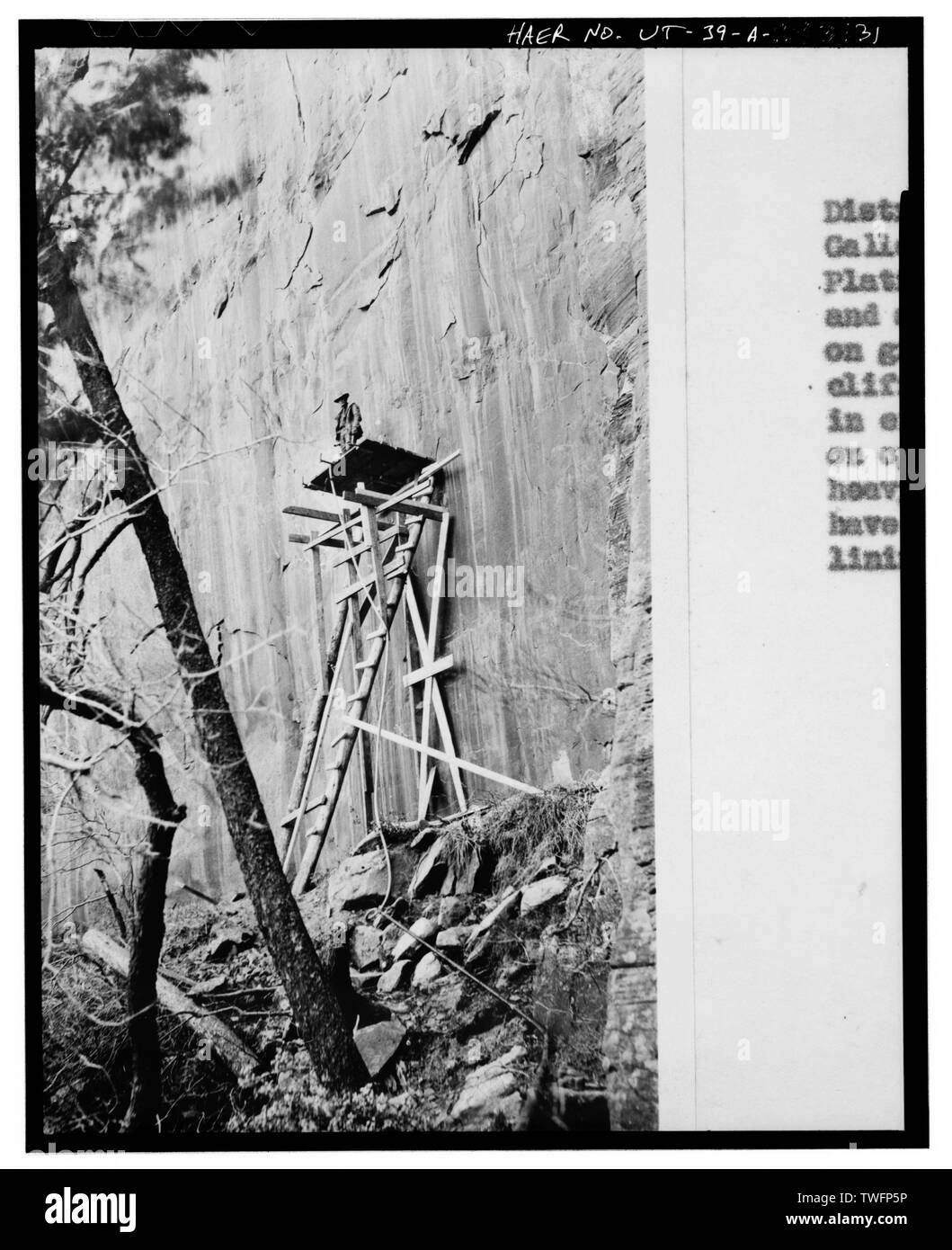 PREPARING TO BORE GALLERY FROM EXTERIOR FACE OF CLIFF - Zion-Mount Carmel Highway, Tunnel, Two miles east of Zion Canyon Scenic Drive, Springdale, Washington County, UT; Nevada Construction Company; Bureau of Public Roads; Finch, J B; Mitchell, R R; Campbell, K B; Jones, T A; Scott, R N; Gregory, Herbert E; Cement Gun Construction Company; US Geologrical Service; US Bureau of Mining; Crane, W R; Reynolds-Ely Construction Co; Case Construction Company; Shea and Shea; Jurale, James, historian; Fraser, Clayton B, photographer; Anderson,  Michael, historian; Grogan, Brian C, photographer Stock Photo