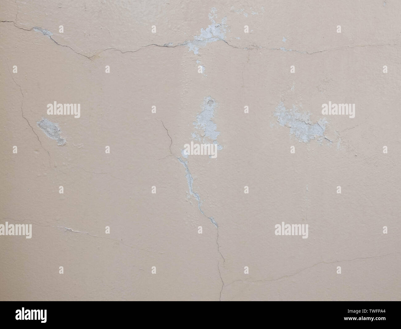 Cracks on the plastered wall surface. Abstract background texture concept Stock Photo