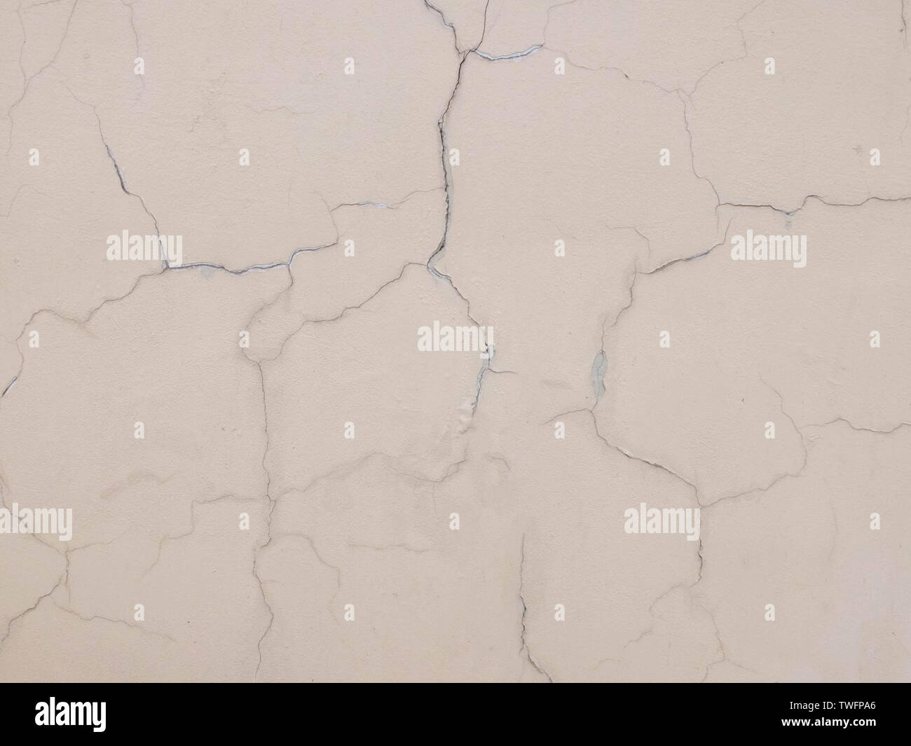 Cracks on the plastered wall surface. Abstract background texture concept Stock Photo
