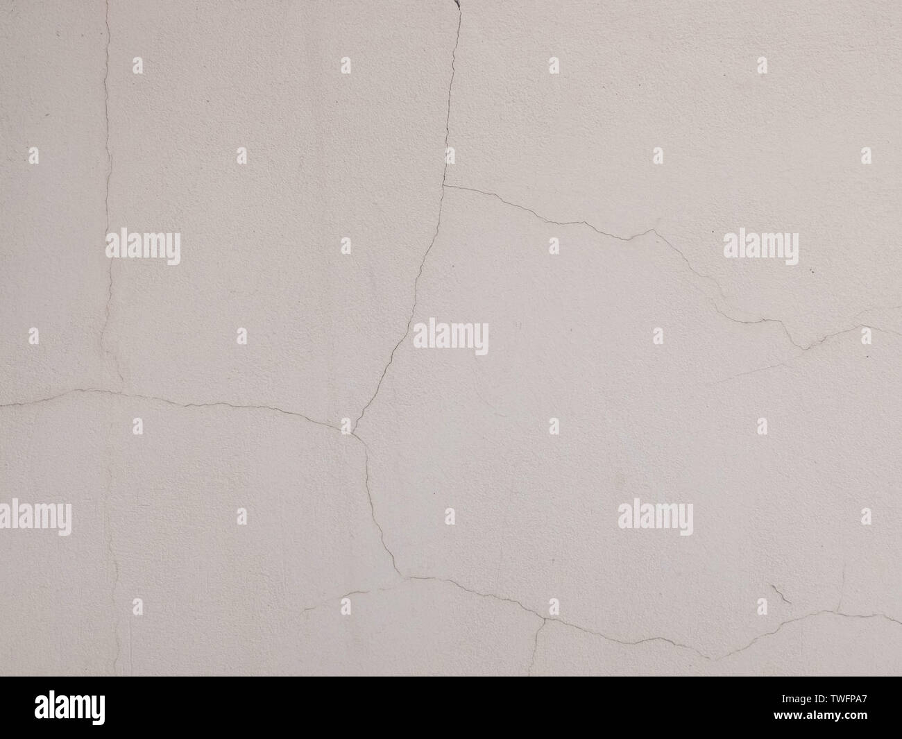 Cracks on the plastered wall surface. Abstract background texture concept Stock Photo