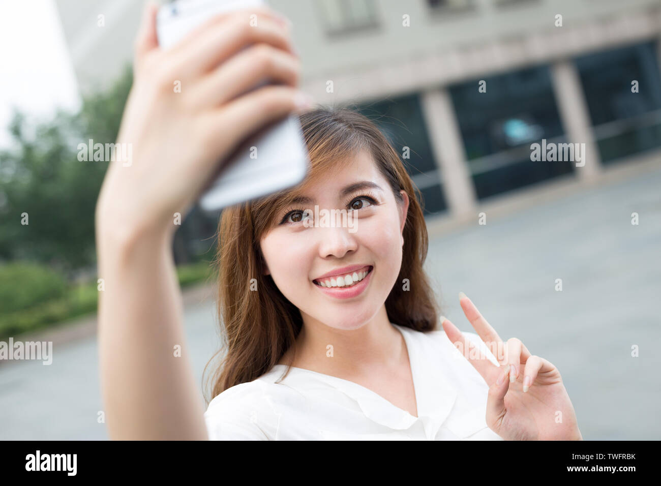 asian beautiful young woman using mobile phone to take selfie ou Stock ...