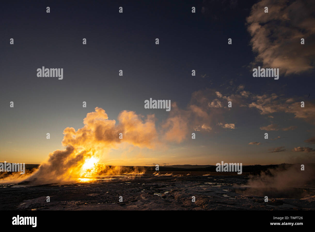 Sunset behind Clepsydra Geyser, a Fountain Group Geyser, Yellowstone National Park Stock Photo