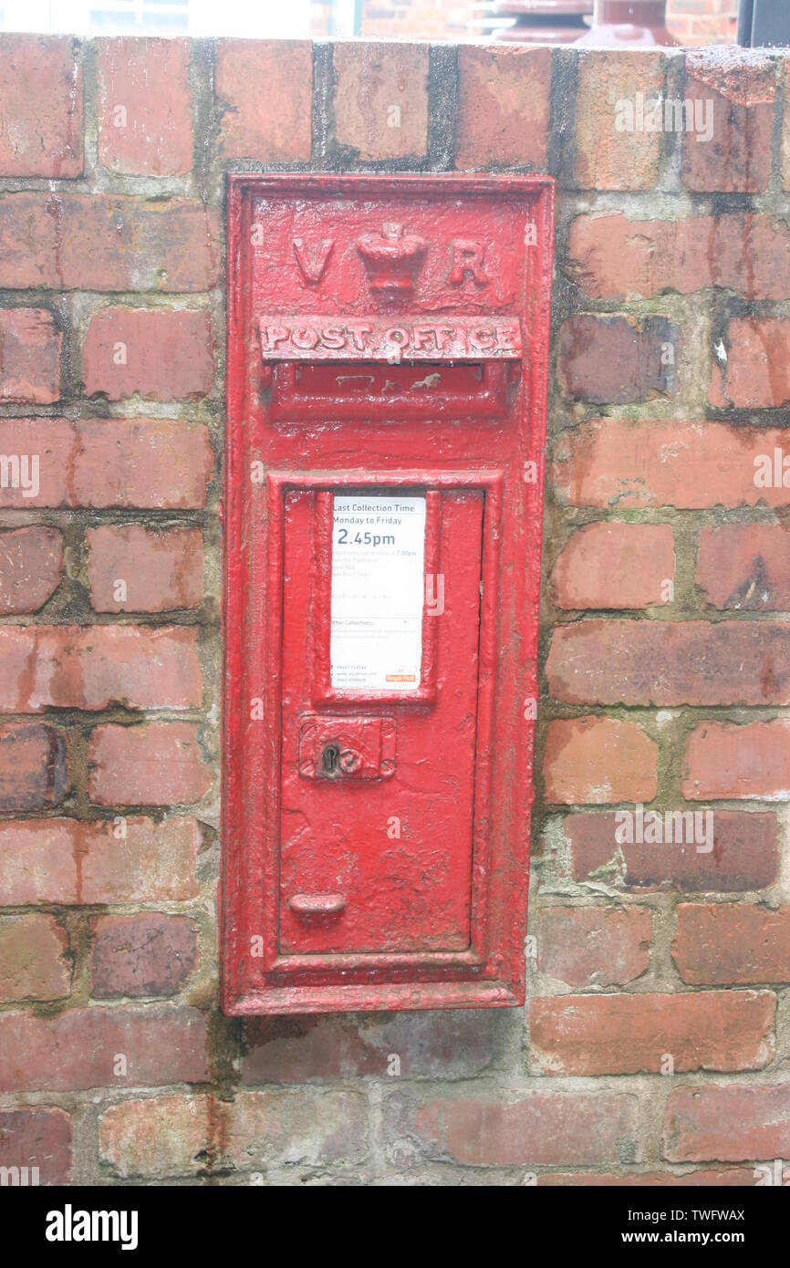 Victorian cast iron inset letter box at the entrance of Gladstone Pottery Museum Stock Photo
