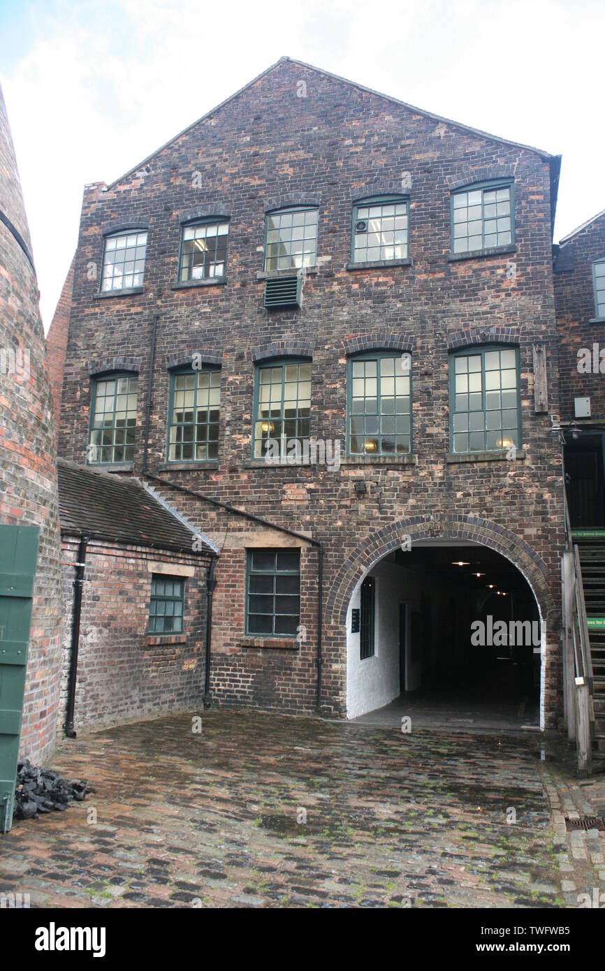 Gladstone Pottery Museum cobbled court yard with worker's tunnel entrance Stock Photo