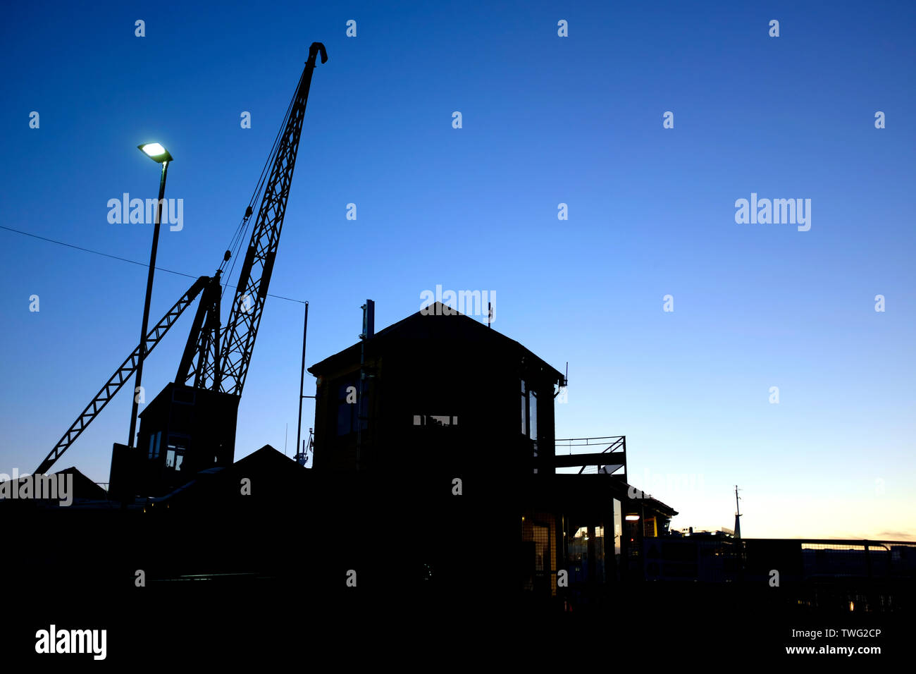 harbor,boom,Crane,silhouette,Thetis,wharf,dock,boat,yard,dawn,sunrise,Cowes,Isle of Wight, Stock Photo