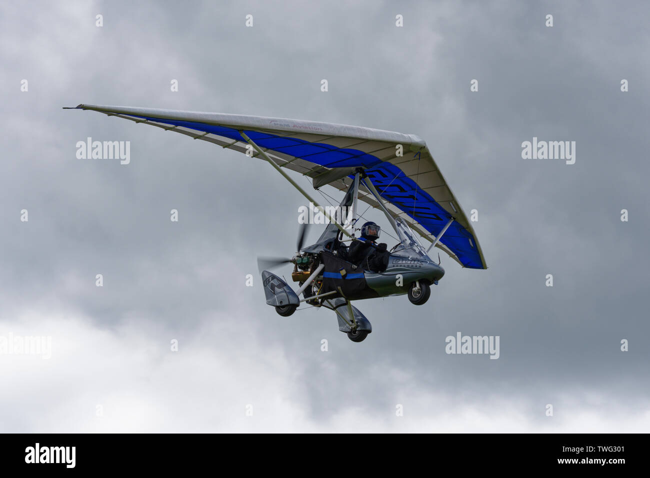 Smart looking Quik GTR flex wing microlight aircraft flying above Popham Airfield near Basingstoke Hampshire Stock Photo