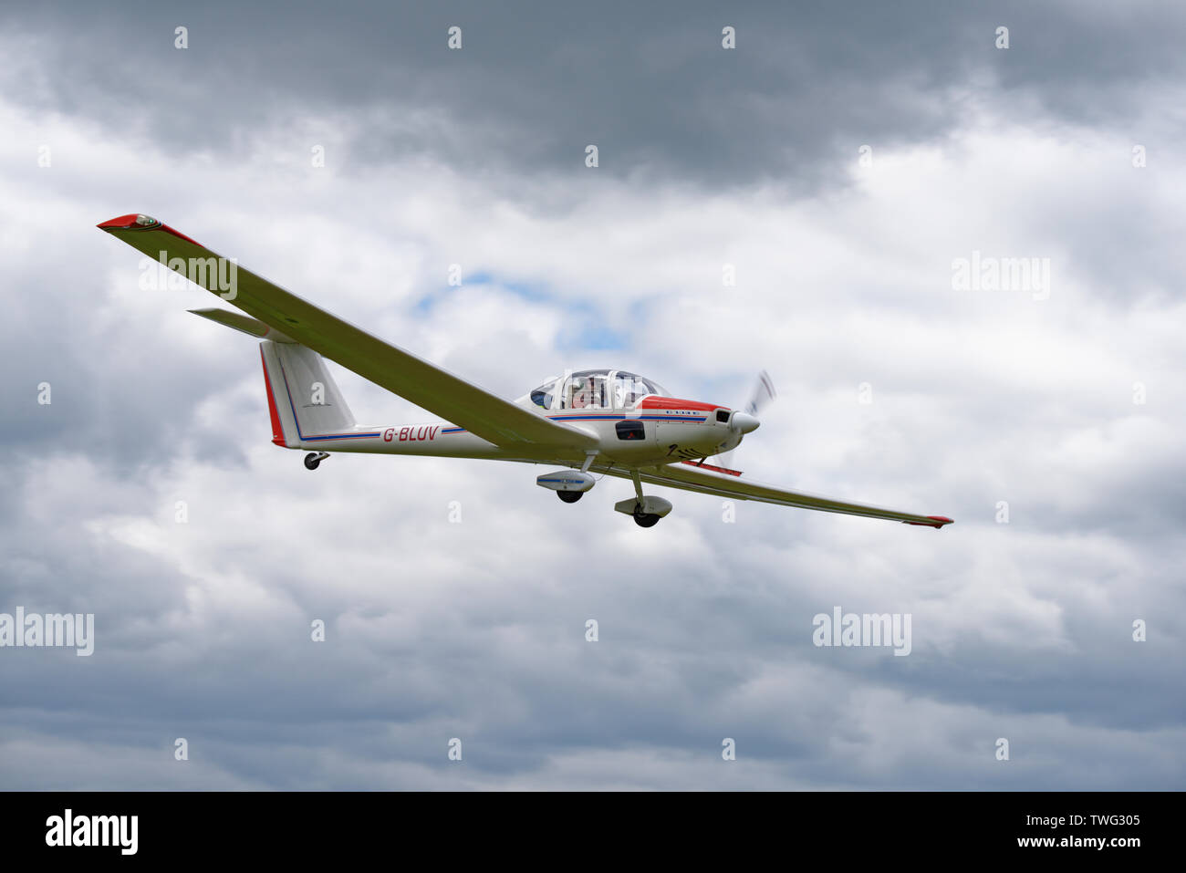 German manufactured Grob G109B motor glider on final approach for a landing at Popham airfield near Basingstoke in Hampshire. Stock Photo