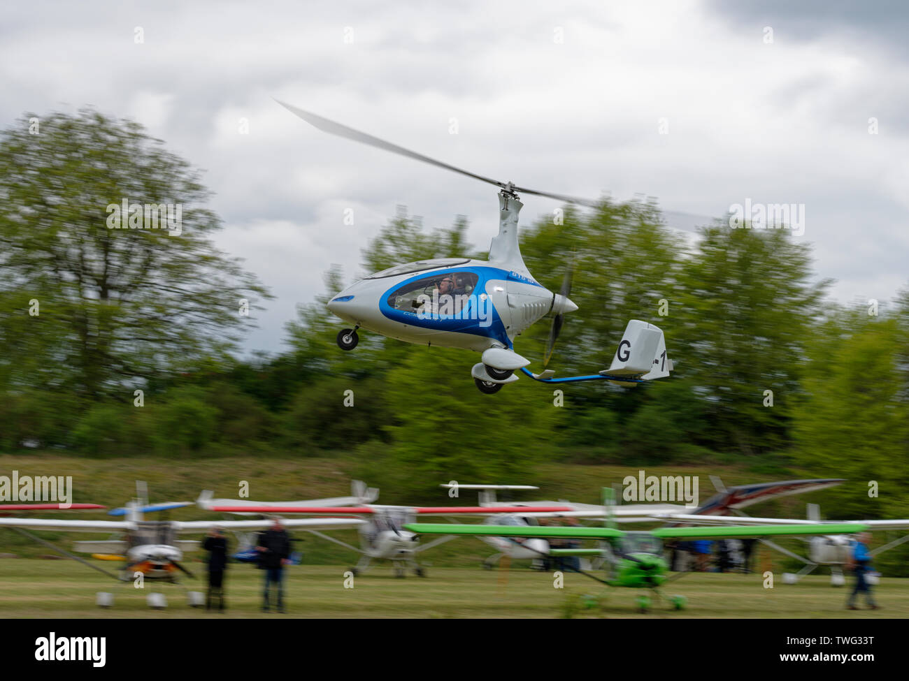 Rotorsport Cavalon Autogyro rotary aircraft takes off from Popham airfield in Hampshire Stock Photo