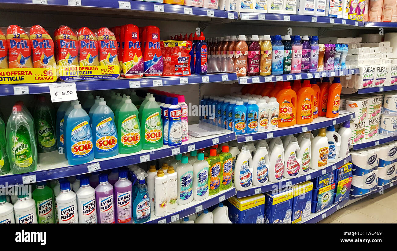 Supermarket shelves with cleaning products detergents, disinfectants