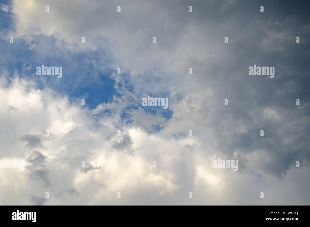 Blue sky background with gray clouds Stock Photo - Alamy