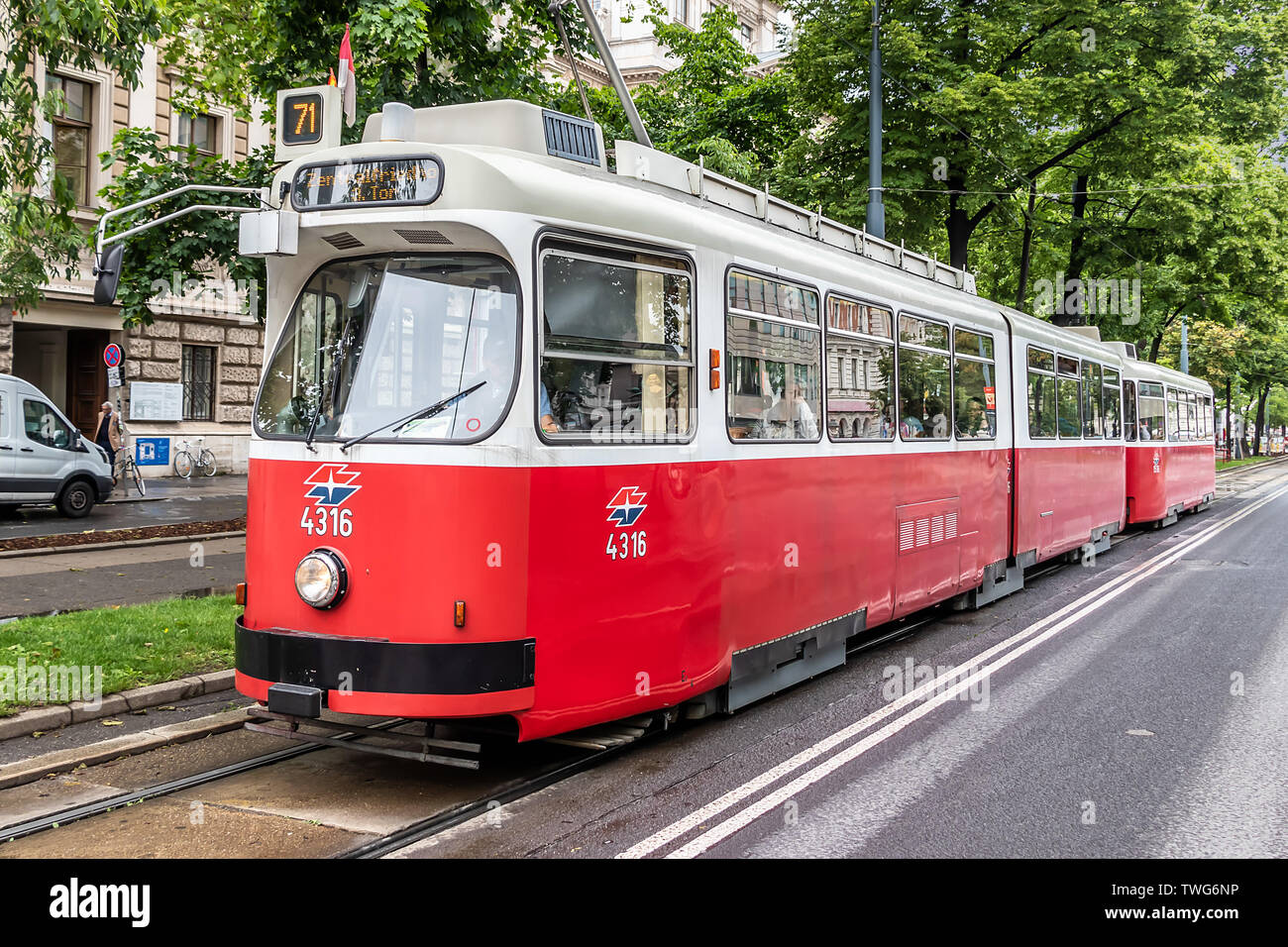 A Lohner E1 tram approaching a tramway stop Stock Photo