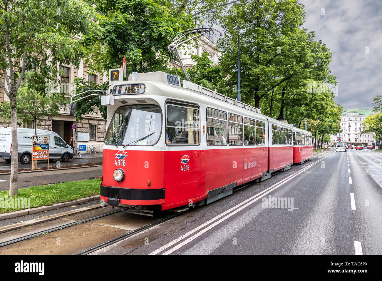 A Lohner E1 tram approaching a tramway stop Stock Photo
