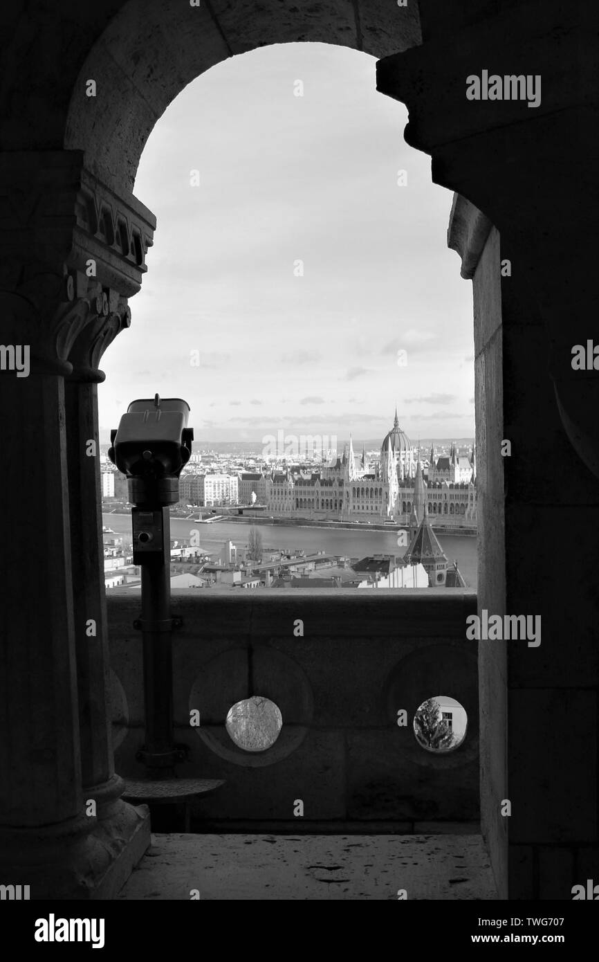 View through an archway at Fisherman's Bastion, on the Buda side of Budapest, of the river Danube, House of Parliament and the Pest side of the city. Stock Photo