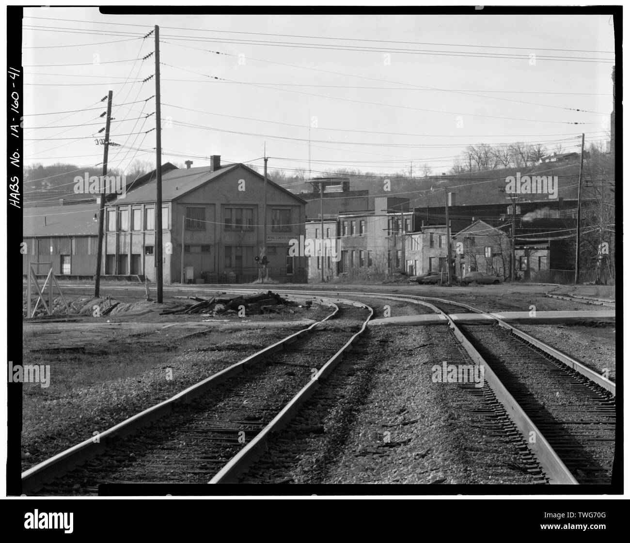 RAILROAD TRACKS, WITH ILLINOIS CENTRAL FREIGHT DEPOT IN LEFT BACKGROUND. VIEW TO SOUTH. - Dubuque Commercial and Industrial Buildings, Dubuque, Dubuque County, IA Stock Photo