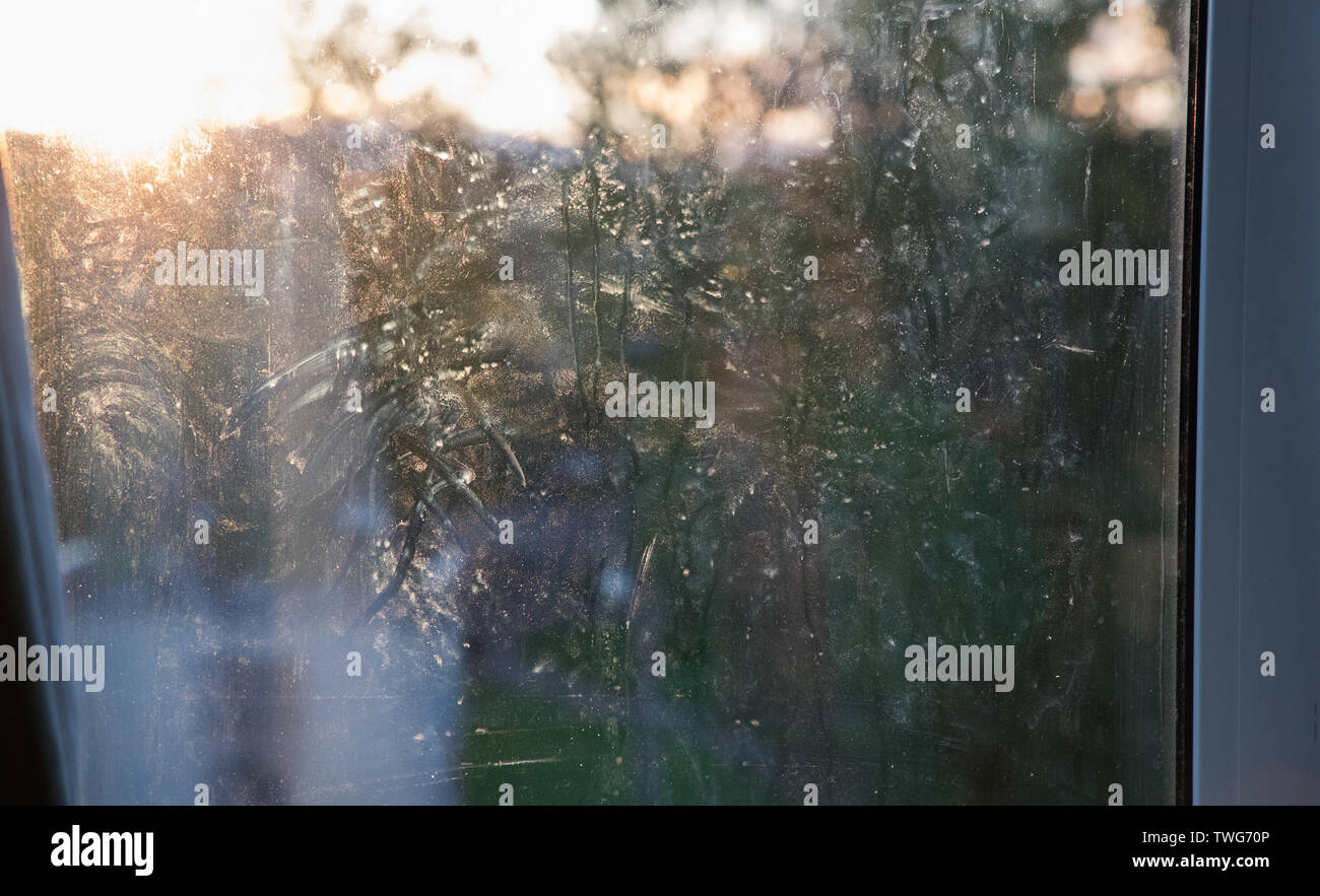 dirty glass windows with frost in the daytime Stock Photo