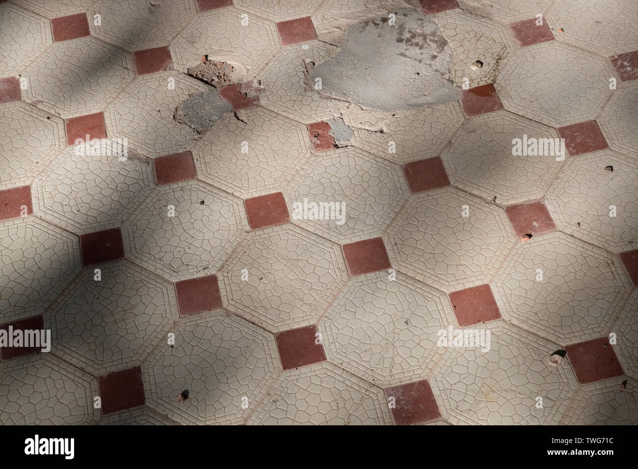dirty and broken floor made of tile Stock Photo
