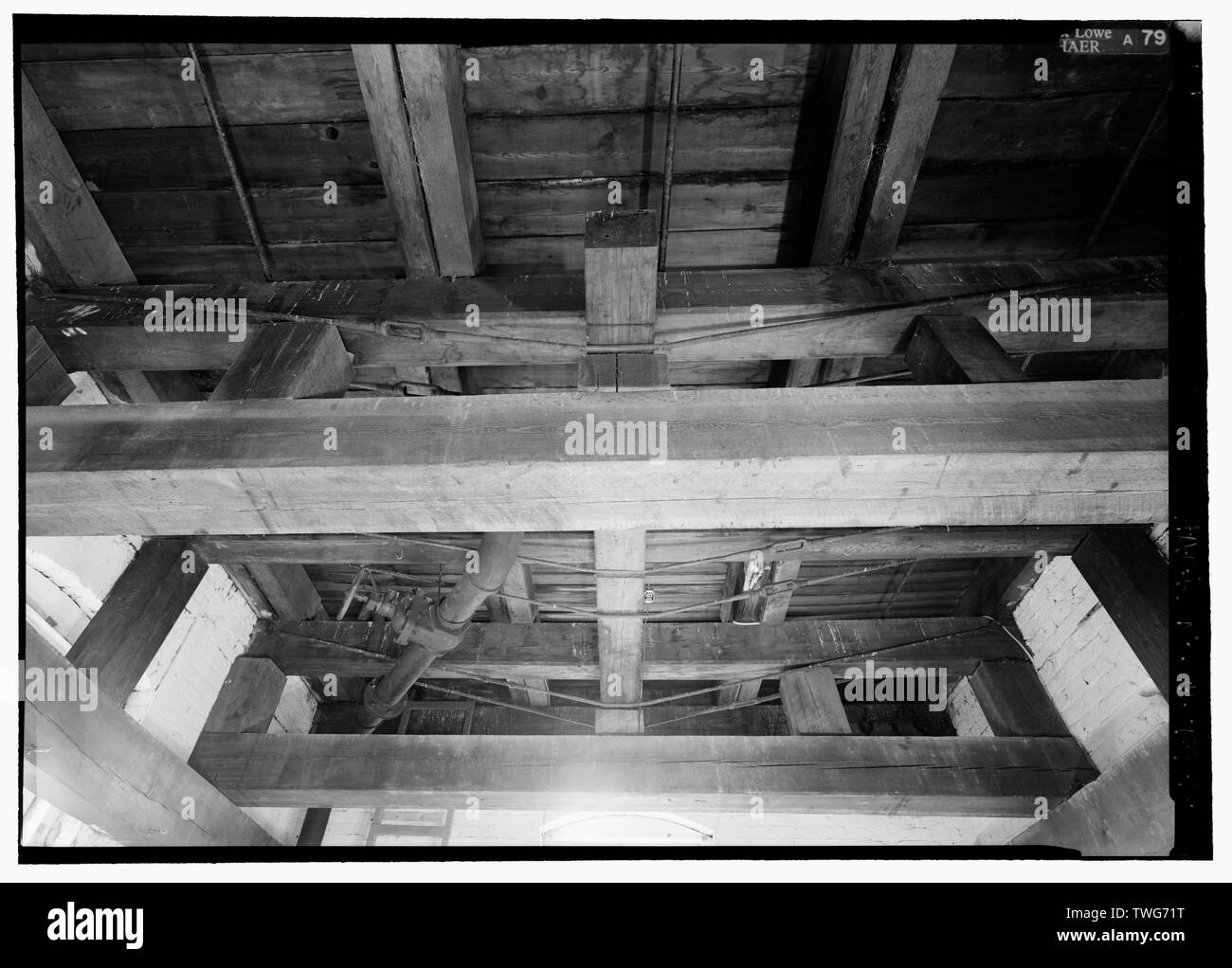 RAILROAD-STYLE REINFORCING BRACING BENEATH WATER TANK, THIRD FLOOR OF WATER TOWER. - Blue Spring Cotton Mill, Route 20, Oxford, Calhoun County, AL Stock Photo