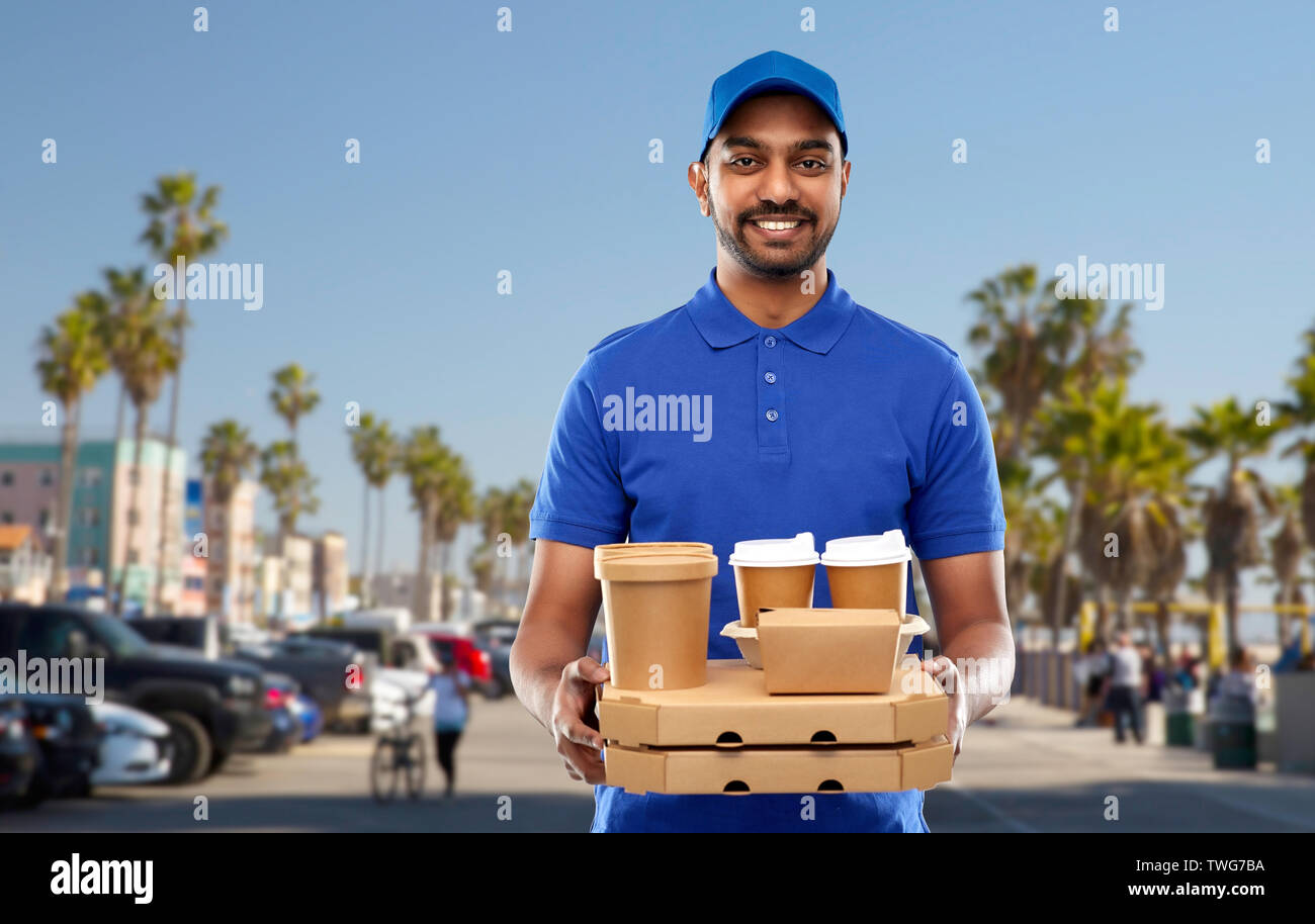 happy indian delivery man with food and drinks Stock Photo Alamy