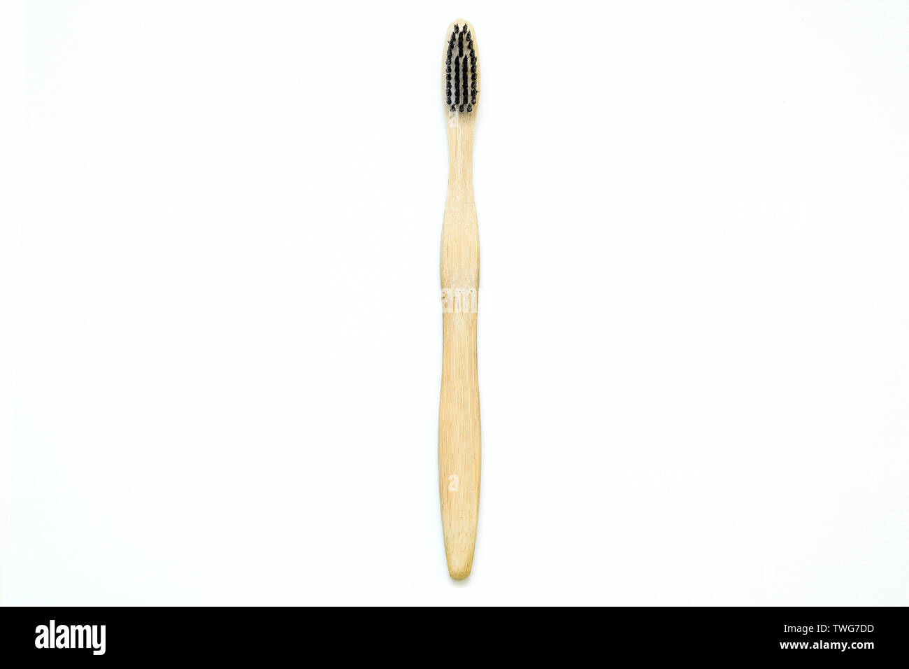 A toothbrush from natural materials. Made from bamboo wood. Isolated on a white background. Stock Photo