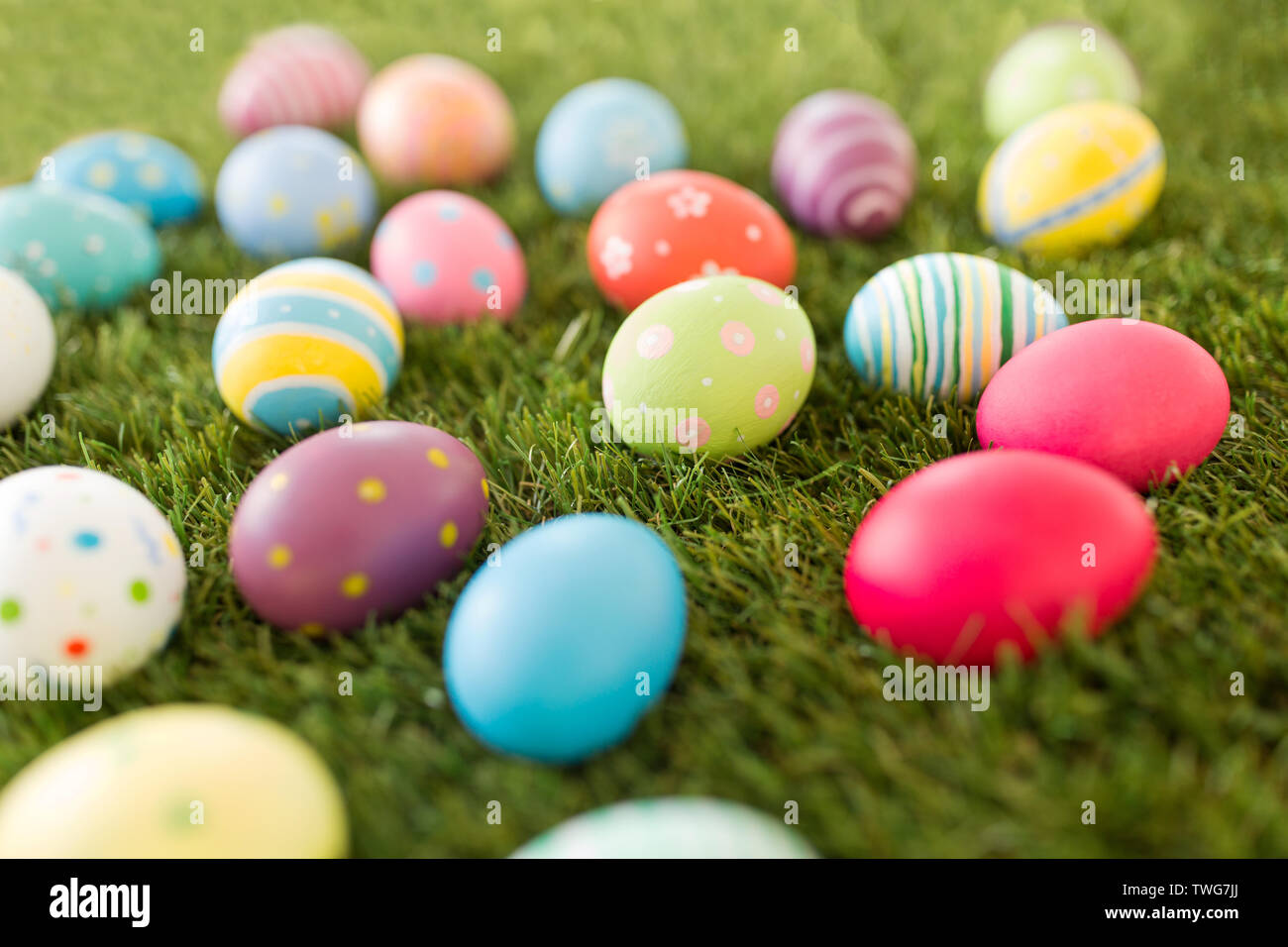 colored easter eggs on artificial grass Stock Photo