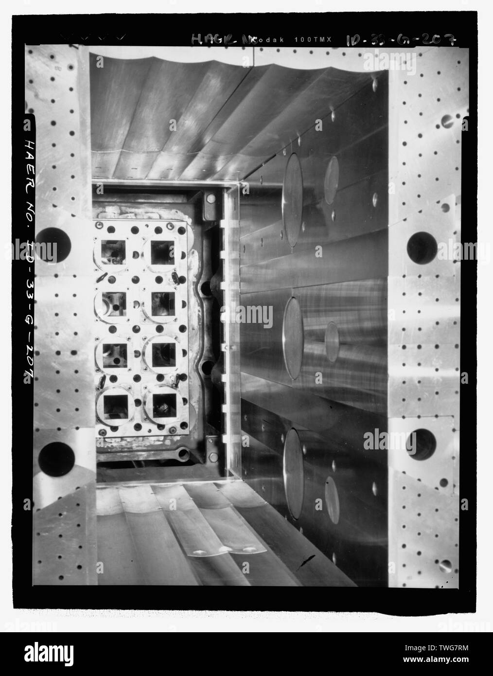 REACTOR CORE SURROUNDED BY BERYLLIUM MODERATOR. CAMERA LOOKS DOWN AND TOWARD NORTH INTO LOWER GRID CASTING. HOLES OF VARIOUS SIZES ACCOMMODATE COOLANT WATER AND EXPERIMENTAL POSITIONS. INL NEGATIVE NO. 4197.; Unknown Photographer, 2-11-1952 - Idaho National Engineering Laboratory, Test Reactor Area, Materials and Engineering Test Reactors, Scoville, Butte County, ID Stock Photo