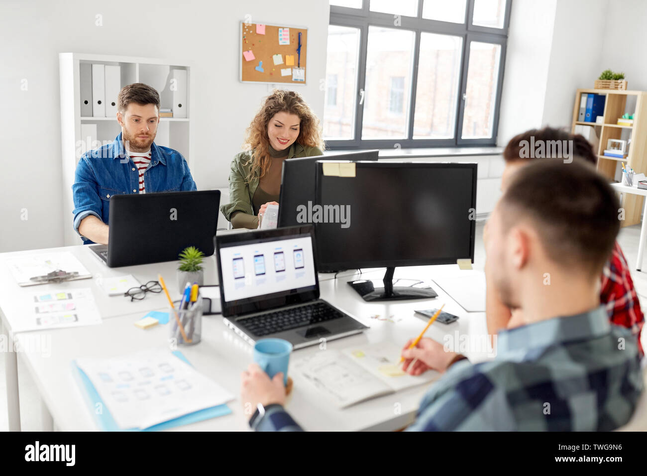 creative team working on user interface at office Stock Photo - Alamy