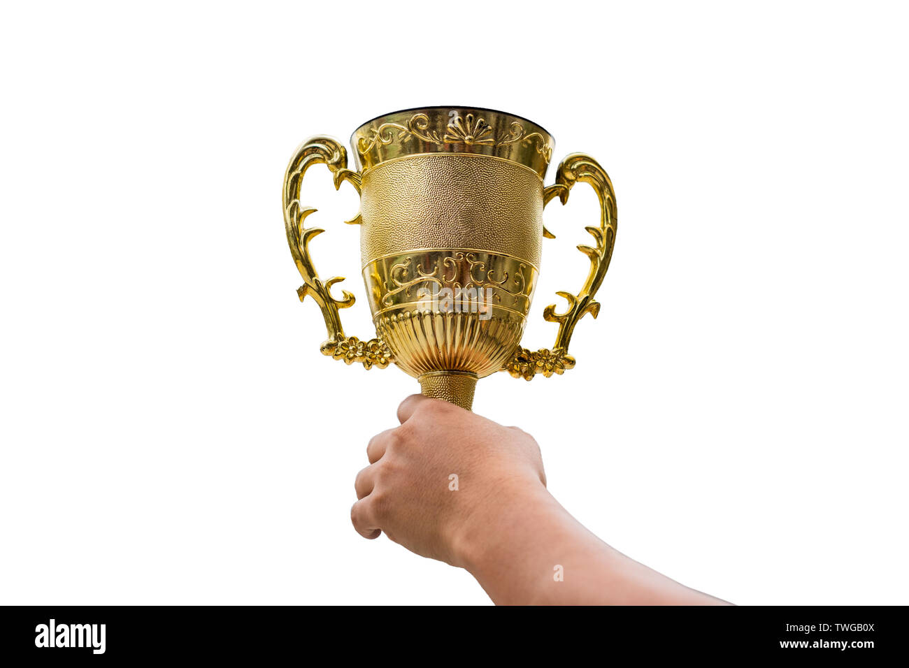 Hand holding golden trophy cup raise up on white background Stock Photo