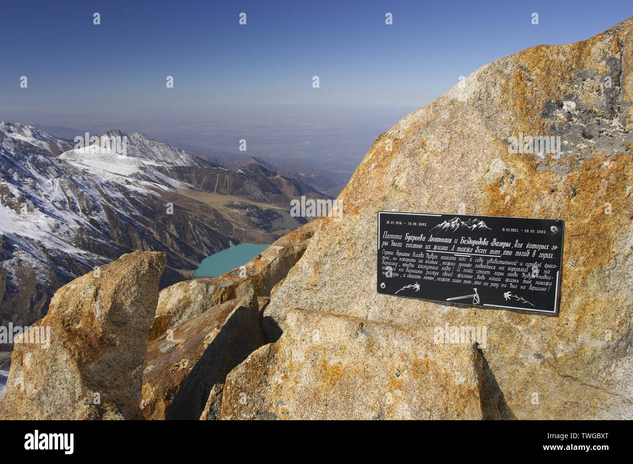 View from Soviet's Peak (4300 m alt.) Tien-Shan. Kazakhstan. Memorial plaque on the alp is devote to famous Kasakhstan alpinists A.Bookreyev and V.Bez Stock Photo
