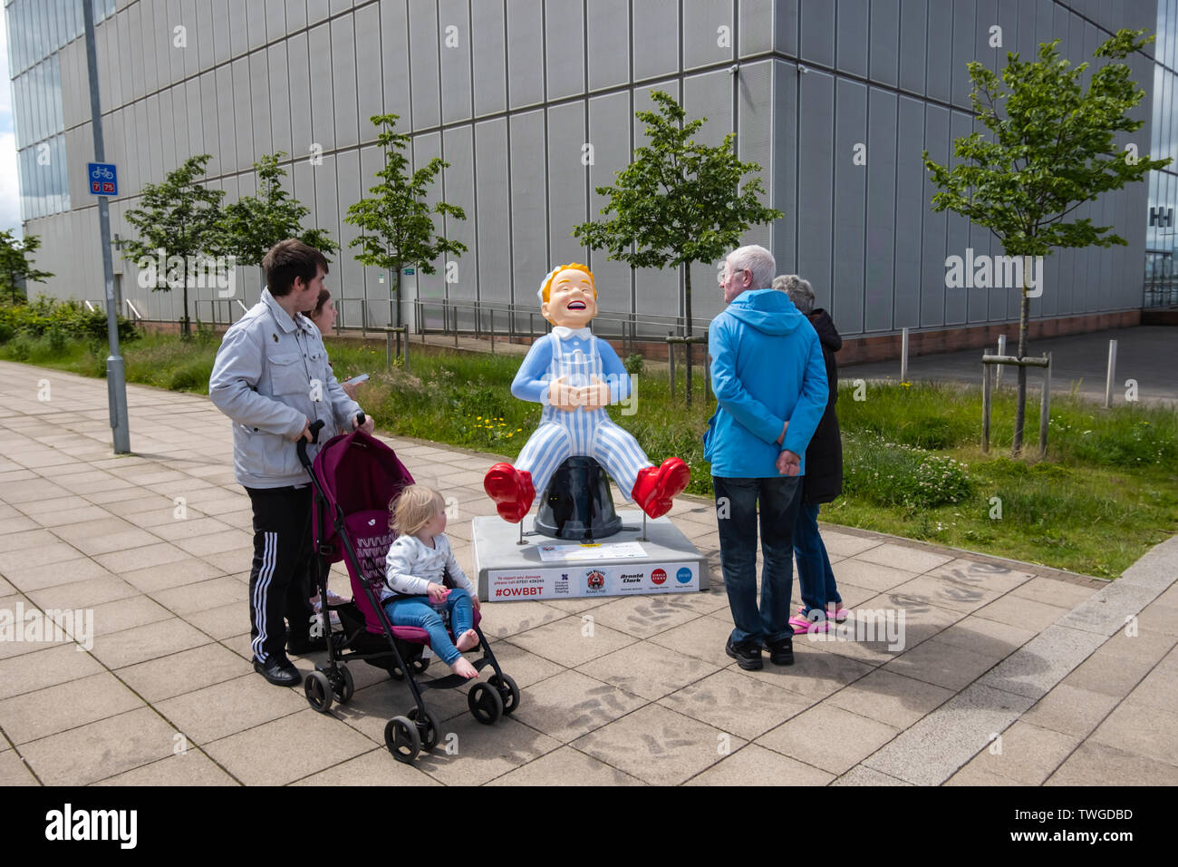 Glasgow, Scotland, UK. 20th June, 2019. Wee Wullie Winkie, created by David Graham. This sculpture is a refernce to the famous Scottish nursery rhyme Wee Willie Winkie written by Glasgwegian William Miller. It sees Oor Wullie dressed in his nightcap and pyjamas, sitting on his bucket, which depicts the Glasgow skyline at night. He is stretching his legs after waking from a  long night's sleep. The sculpture is part of Oor Wullie’s BIG Bucket Trail. Credit: Skully/Alamy Live News Stock Photo