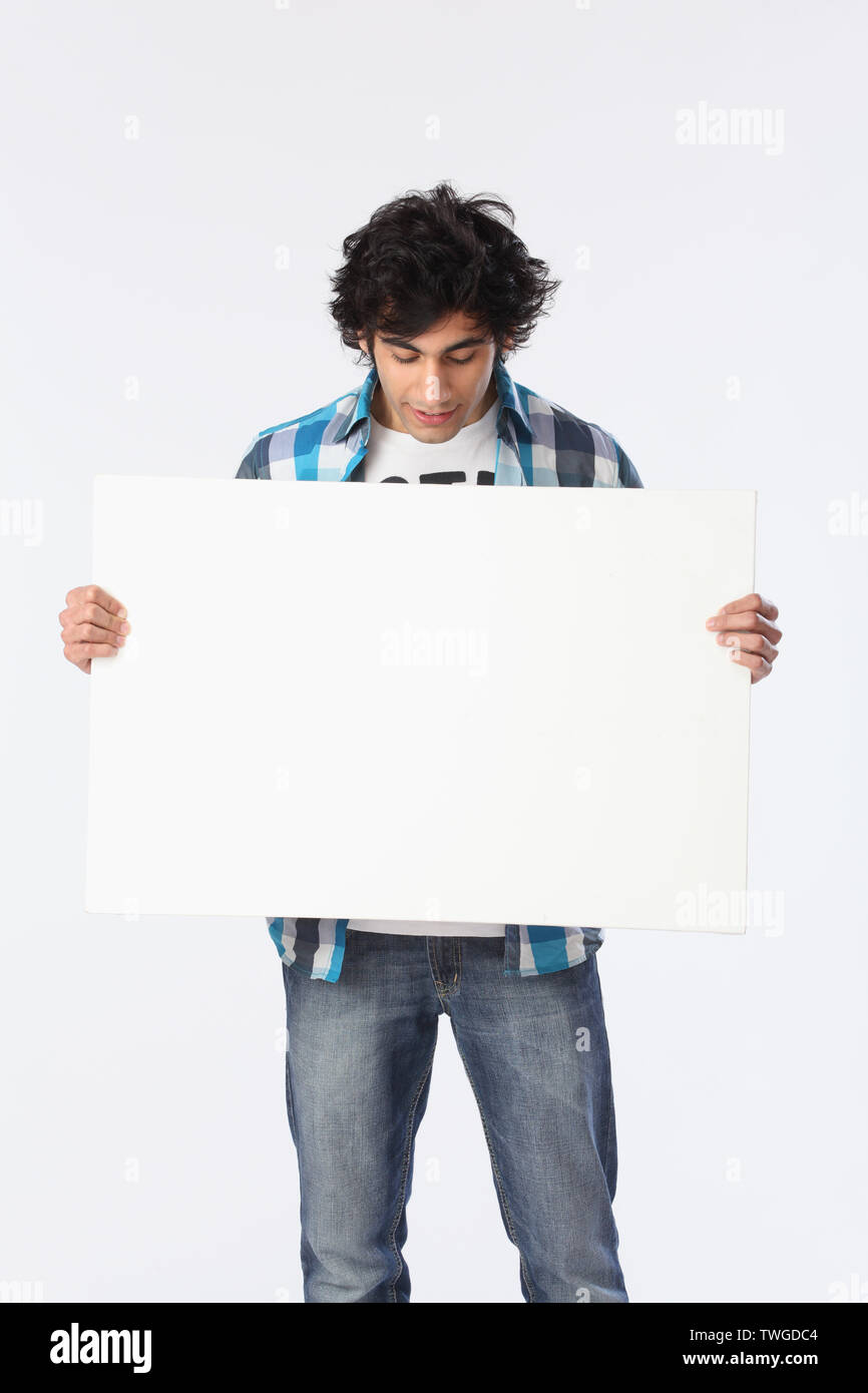 Man holding an empty placard Stock Photo - Alamy