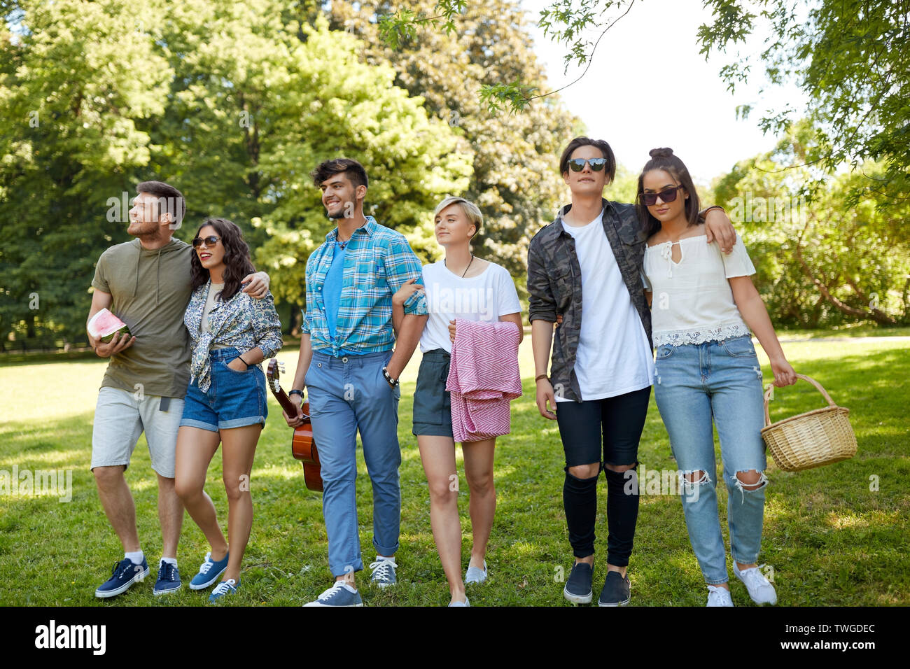 friends with guitar and picnic blanket at park Stock Photo - Alamy