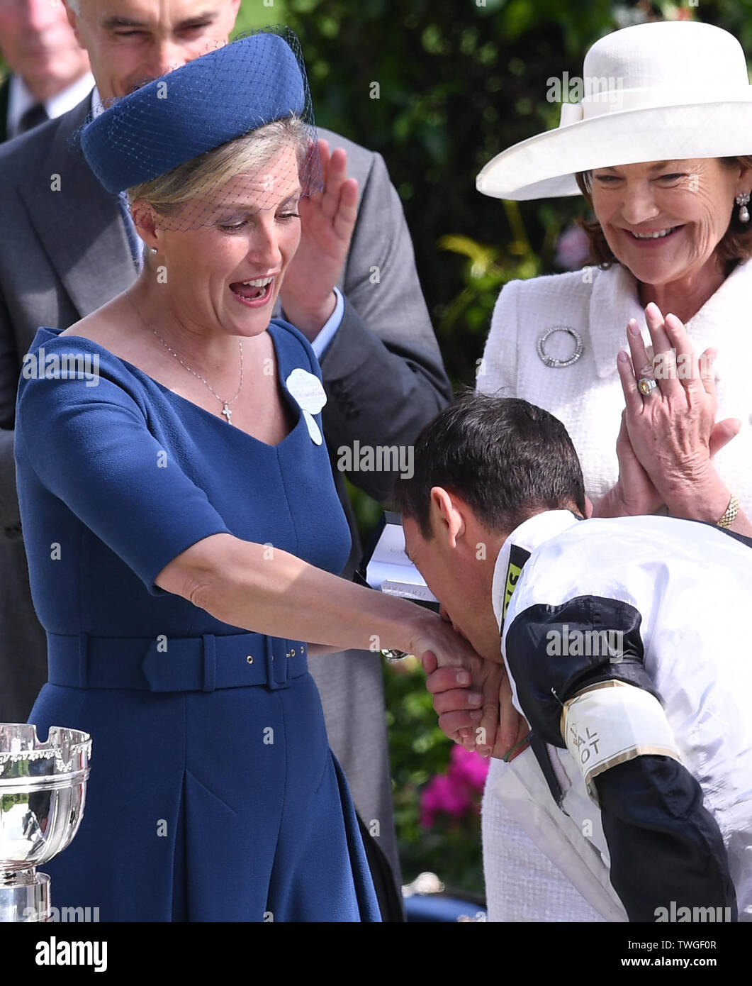ascot-racecourse-ascot-uk-20th-june-2019-royal-ascot-horse-racing-race-3-ribblesdale-stakes-the-countess-of-wessex-reacts-as-frankie-dettori-kisses-her-hand-before-she-presents-him-with-the-winning-jockeys-trophy-credit-action-plus-sportsalamy-live-news-TWGF0R.jpg
