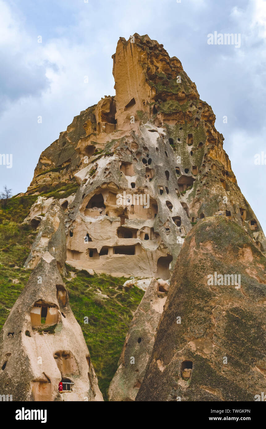 Abandoned dwellings in the rocks of volcanic tuff in Turkish Cappadocia. Goreme National Park. Stock Photo