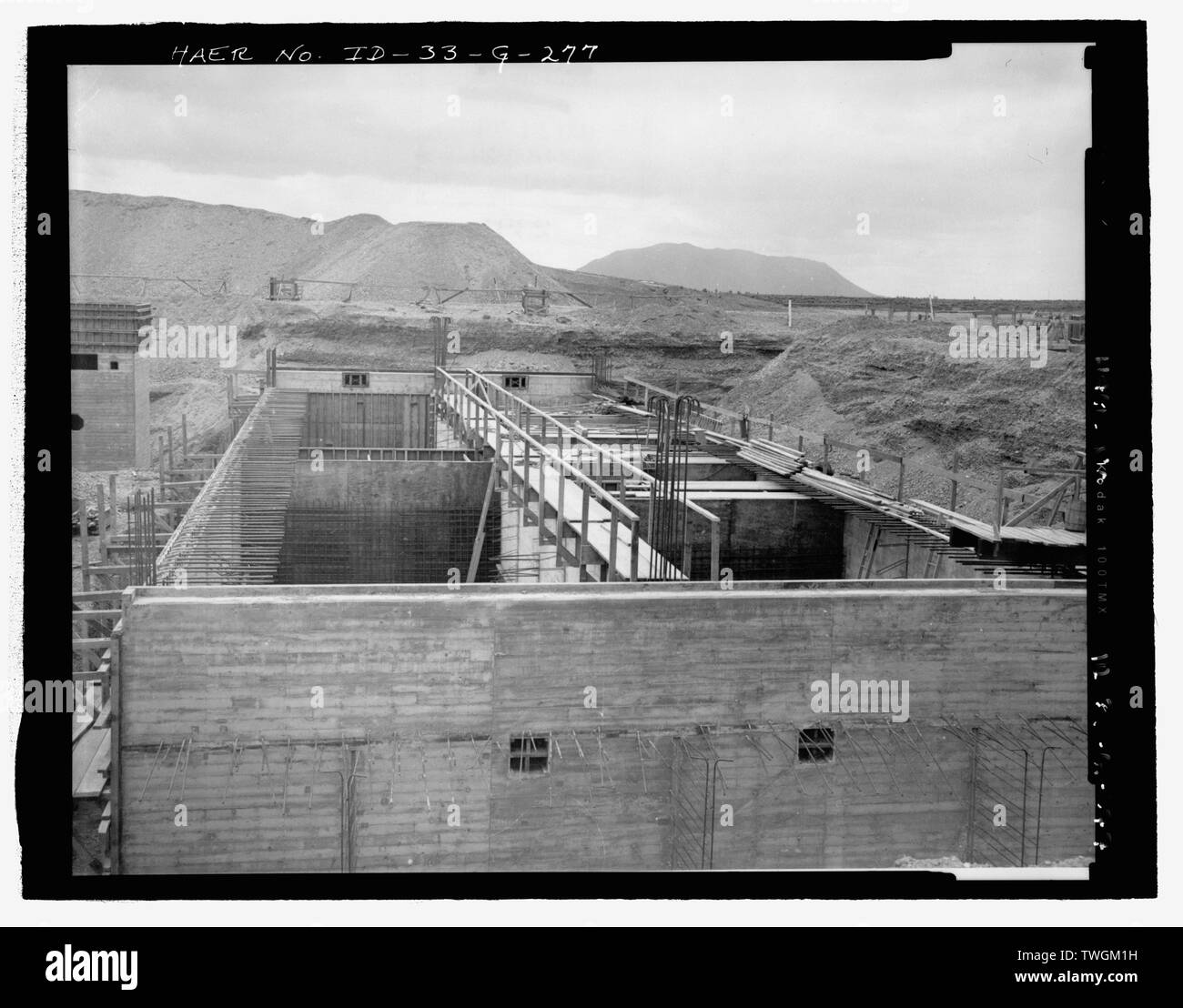 RETENTION BASIN, ASSOCIATED WITH PUMP HOUSE, TRA-636. TWO REINFORCED CONCRETE BASINS ARE ADJACENT TO ONE ANOTHER. CAMERA FACING SOUTH. INL NEGATIVE NO. 2397A.; Unknown Photographer, 5-13-1951 - Idaho National Engineering Laboratory, Test Reactor Area, Materials and Engineering Test Reactors, Scoville, Butte County, ID Stock Photo
