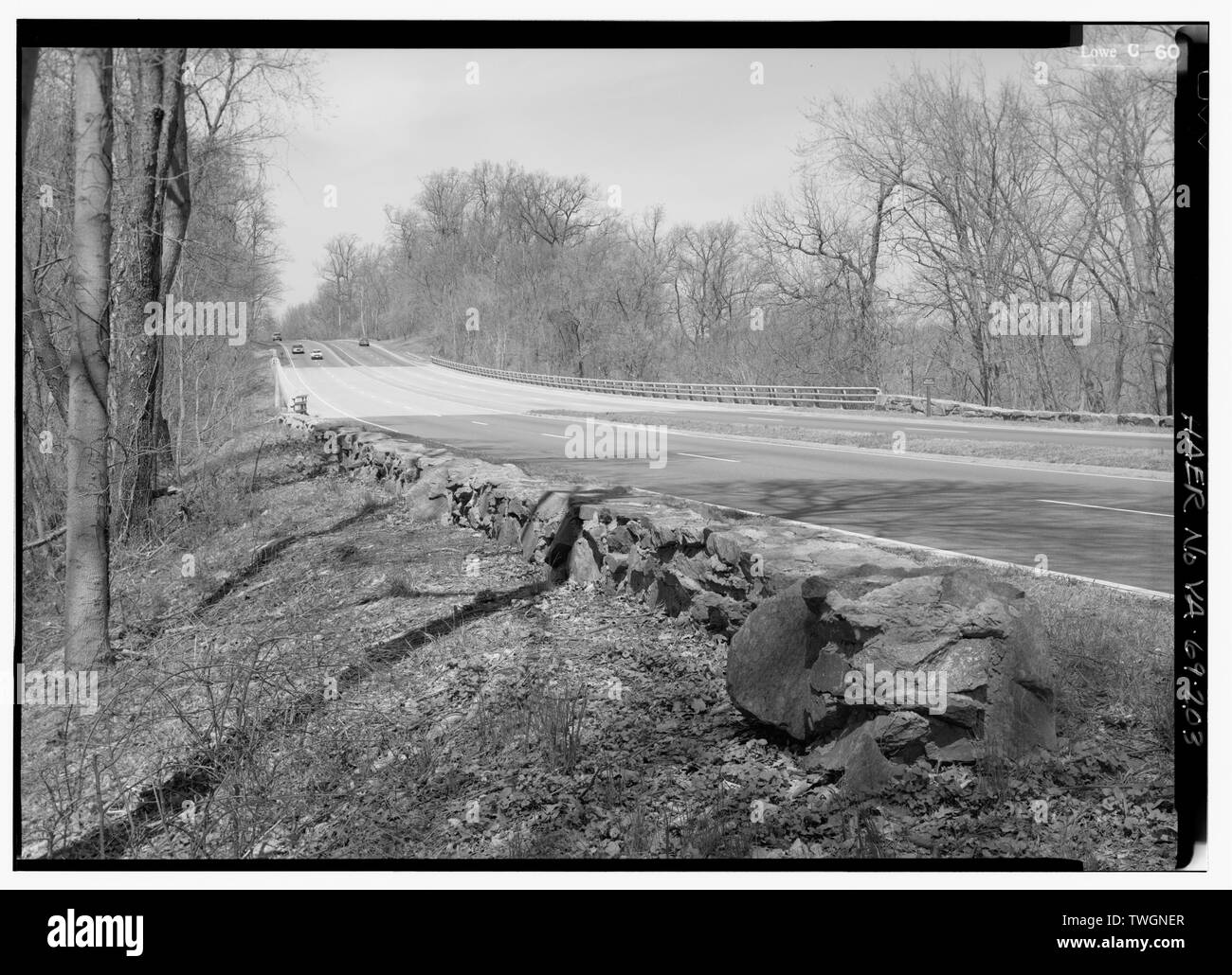 ROAD VIEW OF GULF BRANCH BRIDGE WITH STONE WALL LOOKING NORTH. - George Washington Memorial Parkway, Along Potomac River from McLean to Mount Vernon, VA, Mount Vernon, Fairfax County, VA; Mount Vernon Avenue Association; U.S. Army Corps of Engineers; U.S. Bureau of Public Roads; Clarke, Gilmore; Downer, Jay; Toms, R E; Johnson, J W; Simonson, Wilbur; McNary, J V; Barton, Clara; Mount Vernon Ladies Association; Garden Club of America; Daughters of the American Revolution; United Daughters of the Confederacy; Colonial Dames of America; Association for the Preservation of Virginia Antiquities; Mc Stock Photo