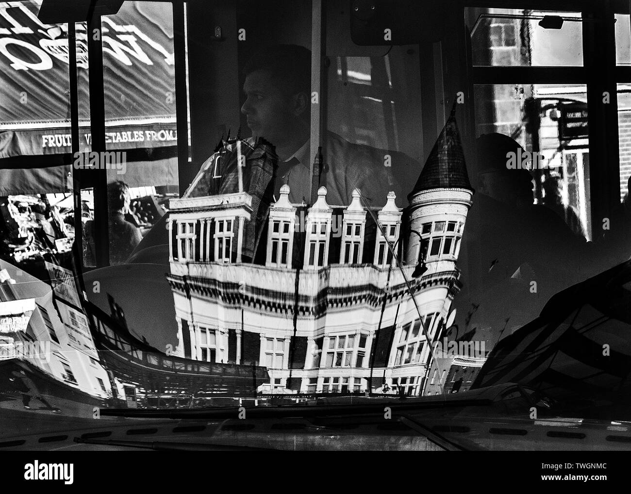 black and white reflection in london bus windscreen of kentish town Assembly house pub London Stock Photo