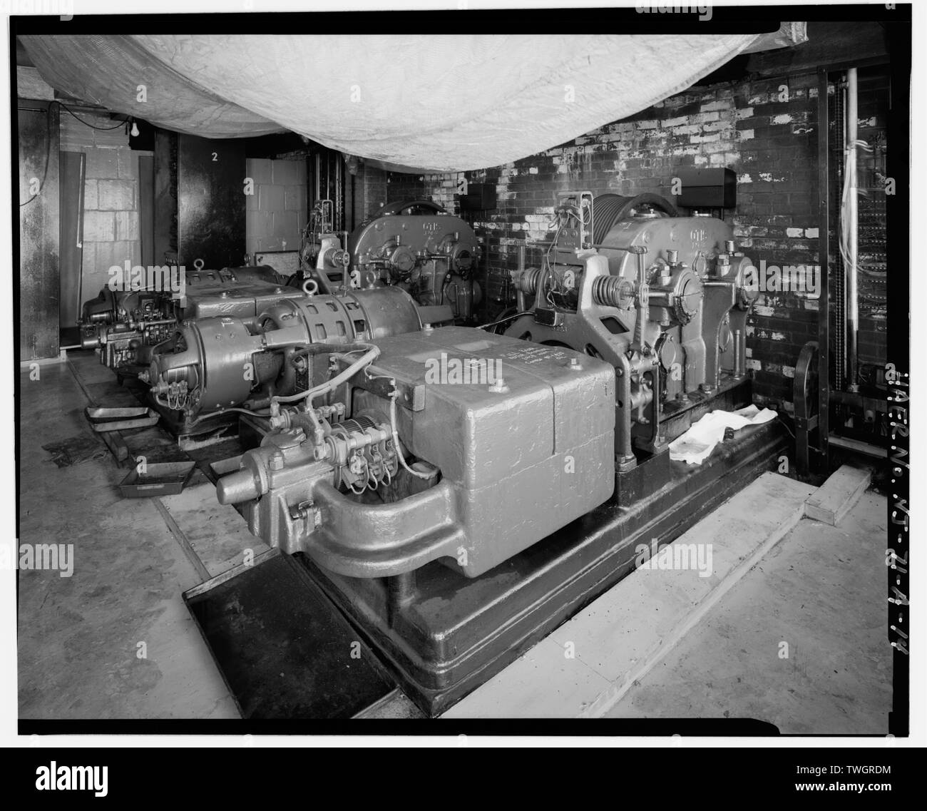 ROOF, OTIS ELEVATOR OPERATING MACHINE (FOREGROUND) AND MOTOR GENERATOR