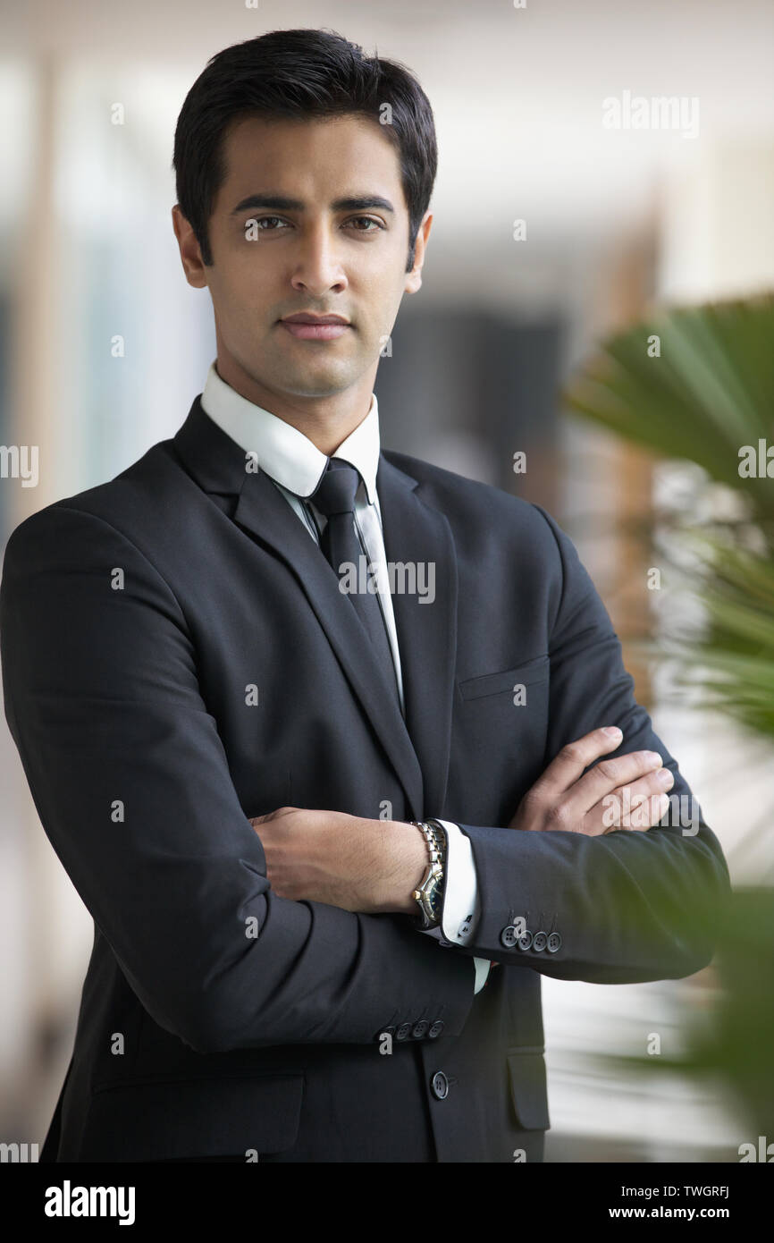 Portrait of a businessman arms crossed Stock Photo - Alamy
