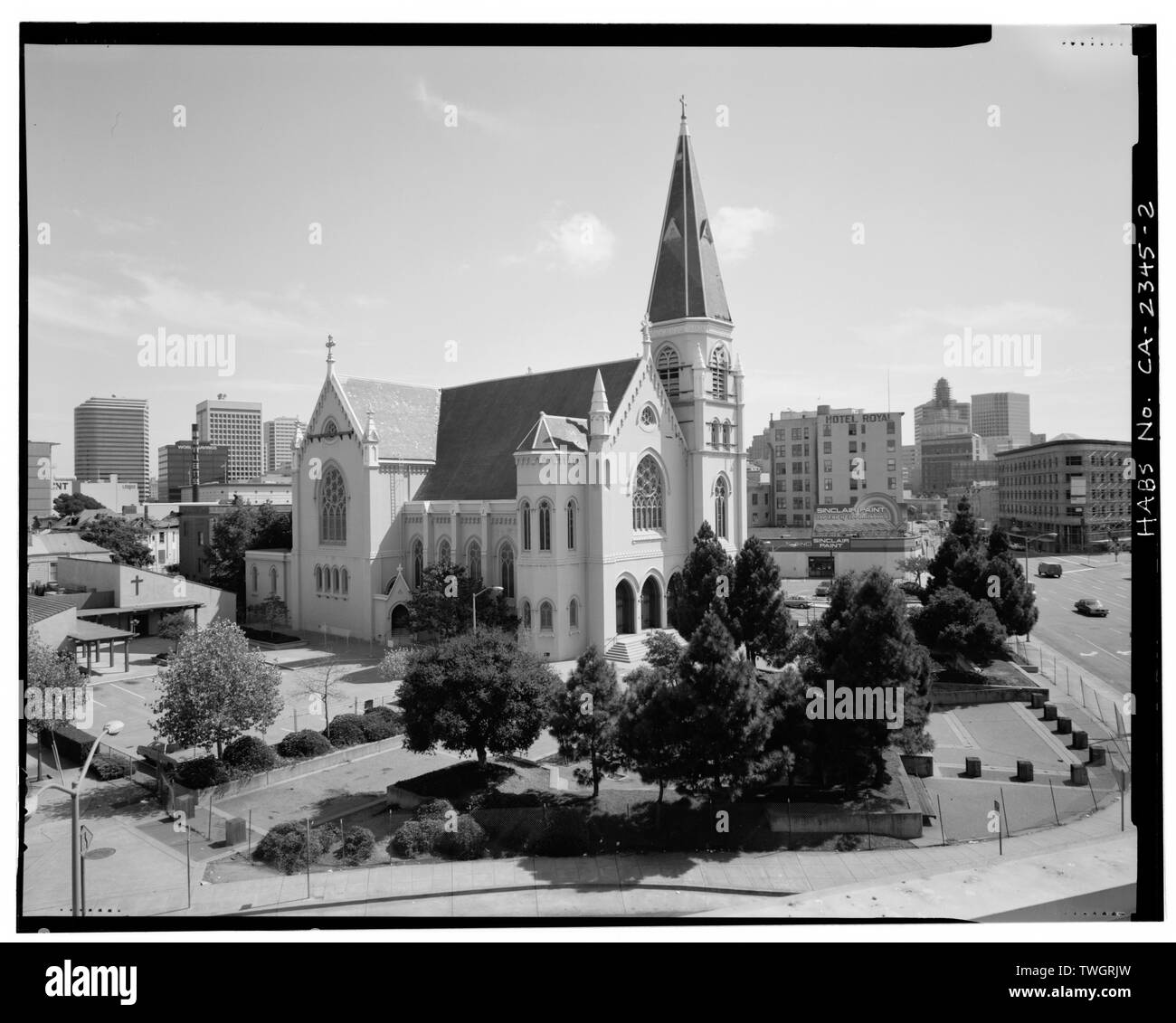 ROOFTOP VIEW TO SOUTH, SHOWING PLAZA, NORTH AND WEST ELEVATIONS, AND OAKLAND SKYLINE - St. Francis de Sales Church, 2100 Martin Luther King, Jr. Way, Oakland, Alameda County, CA Stock Photo