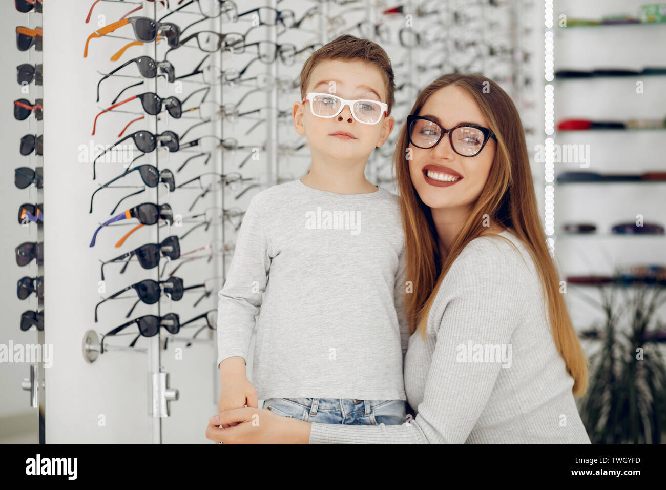 Mother with little son in the glasses store Stock Photo
