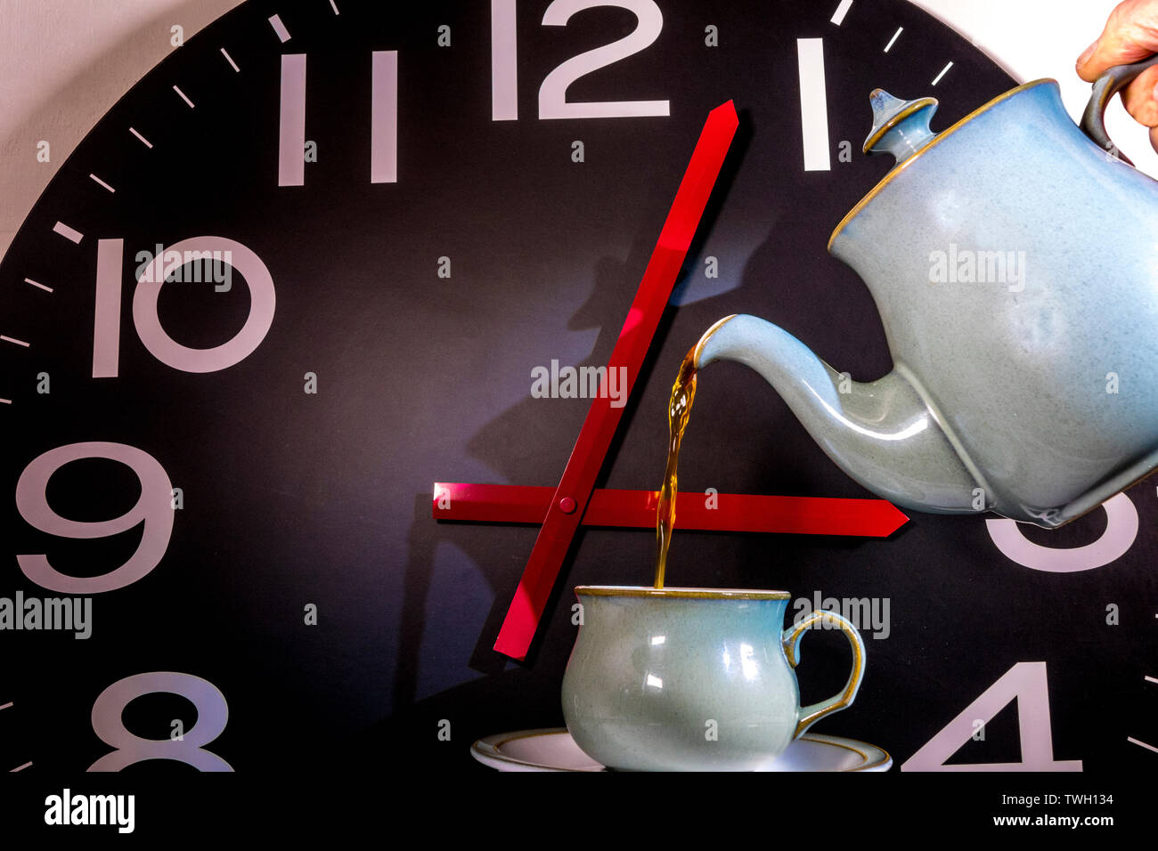 Time for afternoon tea concept: Giant wall clock with hands showing 15. ...