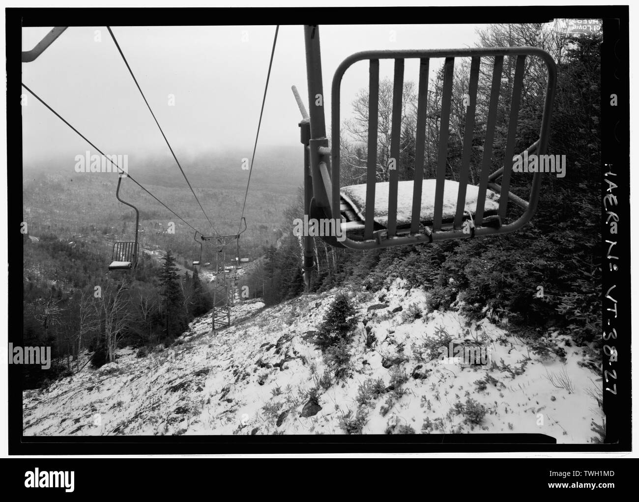 Rear of REPLACEMENT MODEL single chair from mid station. Tower 13 in background, LOOKing northeast. - Mad River Glen, Single Chair Ski Lift, 62 Mad River Glen Resort Road, Fayston, Washington County, VT; American Steel and Wire Company; Mad River Glen Cooperative; Palmedo, Roland; Cooke, James N; J.A. Roebling and Sons; Ski Tow Owners Association; Starr, Cornelius Vander; Mt. Mansfield Company, Inc.; Harris, Fred; Schwarzenbach, Robert; Cooke, Nancy Reynolds; Lord, Charles D; McIlvaine, Alexander Sandy; Bannerman, Gordon H; Curran, James M; Trout, Glen H; Mad River Glen Cooperative, sponsor; C Stock Photo