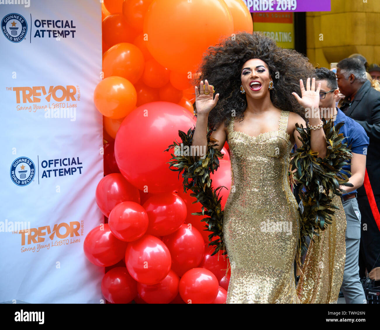 New York, USA,  20 June 2019. Drag Queen Shangela greets the public as she arrives to New York City's Times Square to attend an attempt to break the Guiness World Record title of the longest feather boa at 1.2 miles. The event was organized by Ripley's Believe or not! and Madame Tussauds in celebration of WorldPride and to commemorate the 50th anniversary of the Stonewall Uprising.  Credit: Enrique Shore/Alamy Live News Stock Photo