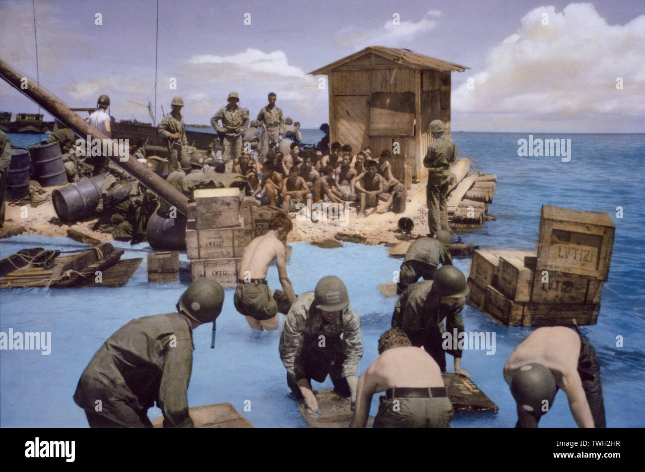 U.S. Marines with Captured Japanese Soldiers and Supplies, Battle of Tarawa, Tarawa Atoll, Gilbert Islands, November 1943 Stock Photo