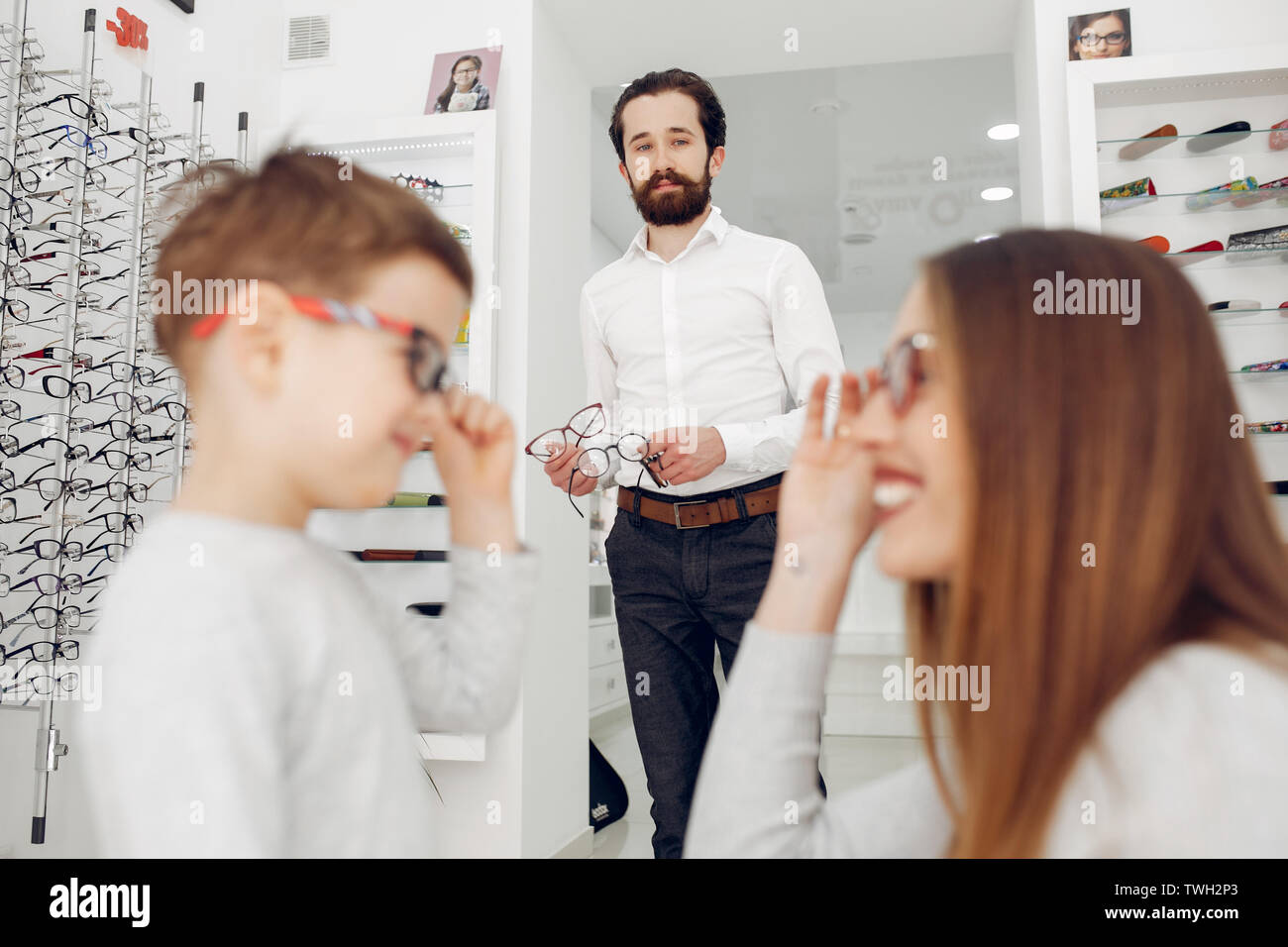 Mother with little son in the glasses store Stock Photo