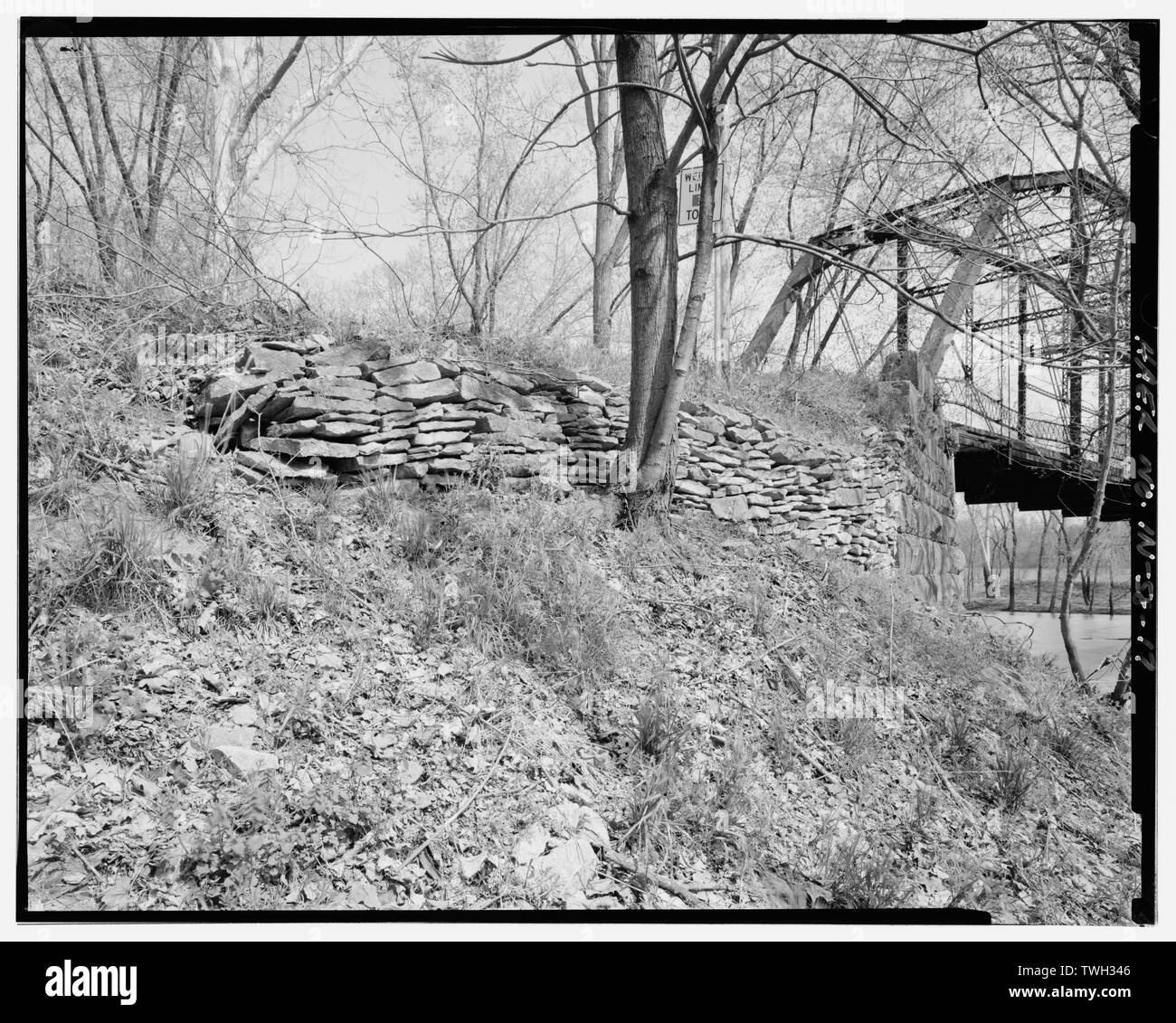Remains old wall along north approach (west side). - River Vale Bridge, Spanning White River on County Road 27, Bedford, Lawrence County, IN Stock Photo