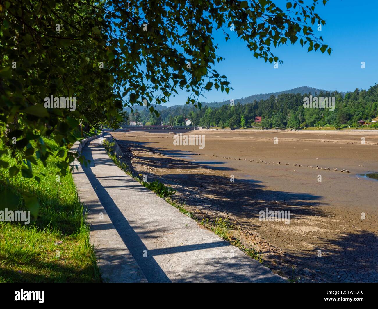Dried lake-bed Bajer in Fuzine Croatia Spring 2019 coastline promenade Stock Photo