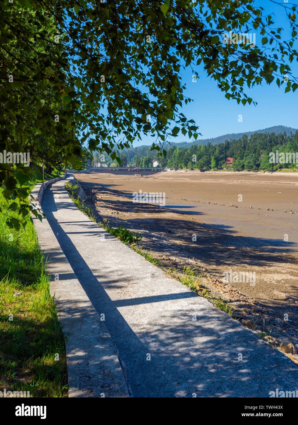Dried lake-bed Bajer in Fuzine Croatia Spring 2019 coastline promenade Stock Photo